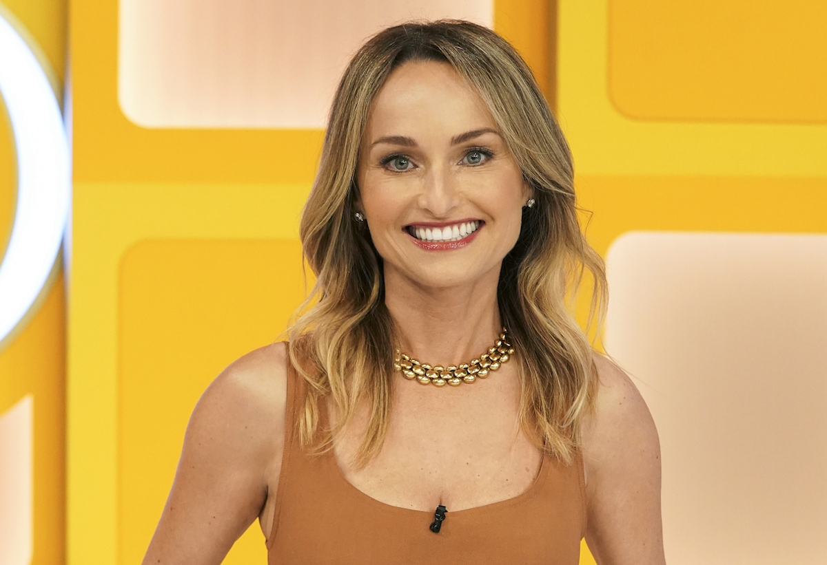 Giada De Laurentiis smiles wearing a tan shirt on 'The Price is Right' set