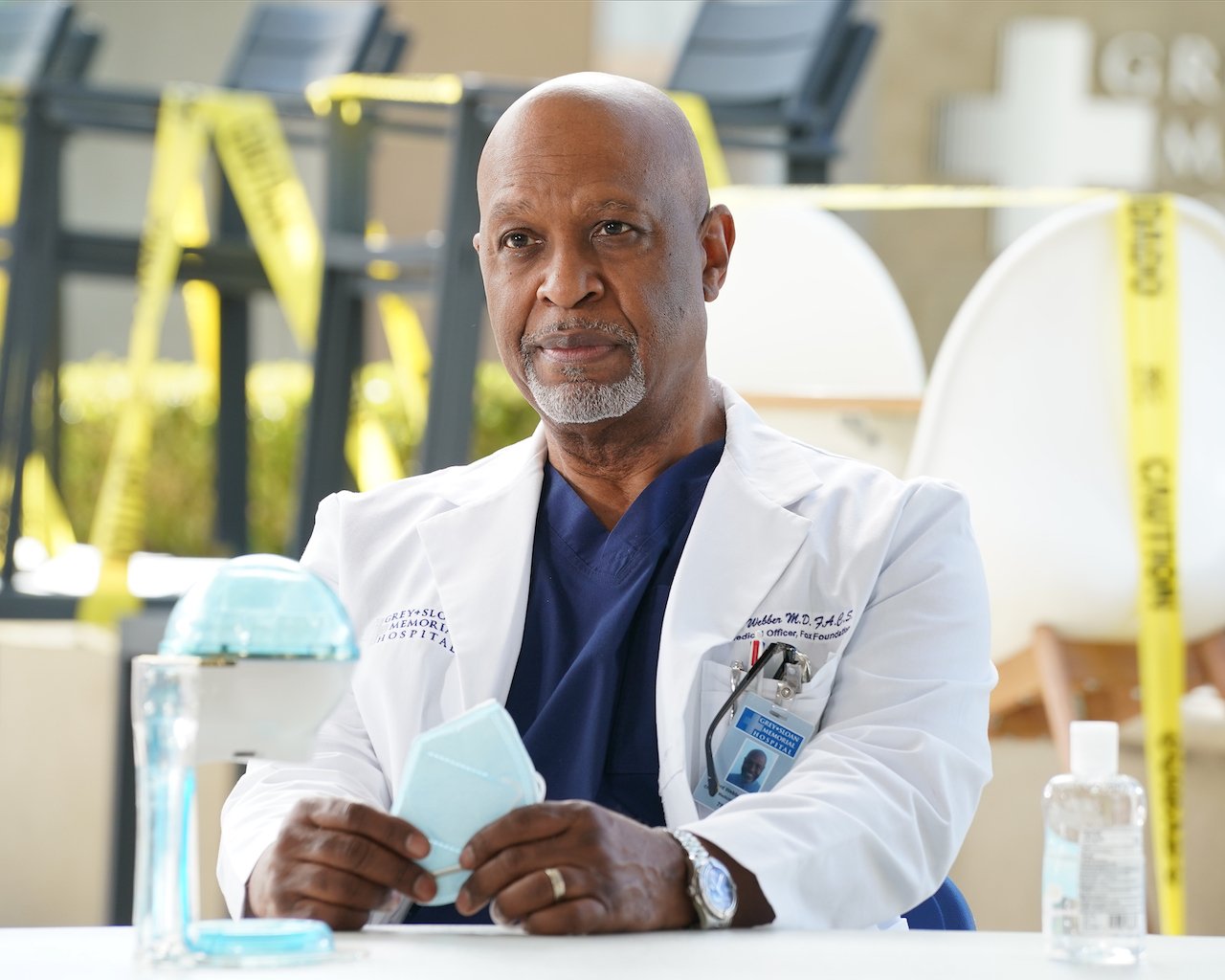 James Pickens Jr. as Dr. Richard Webber sits down wearing a doctor's coat in 'Grey's Anatomy'