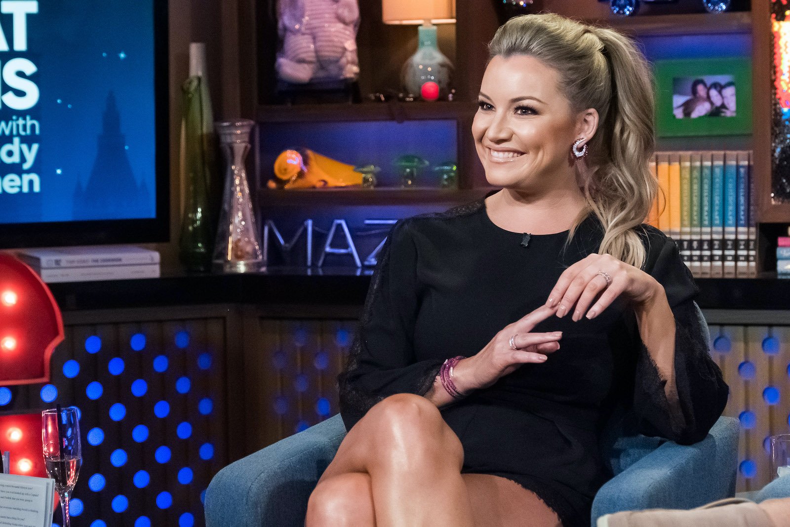 Hannah Ferrier from 'Below Deck Med' sits in a chair at 'WWHL' and smiles