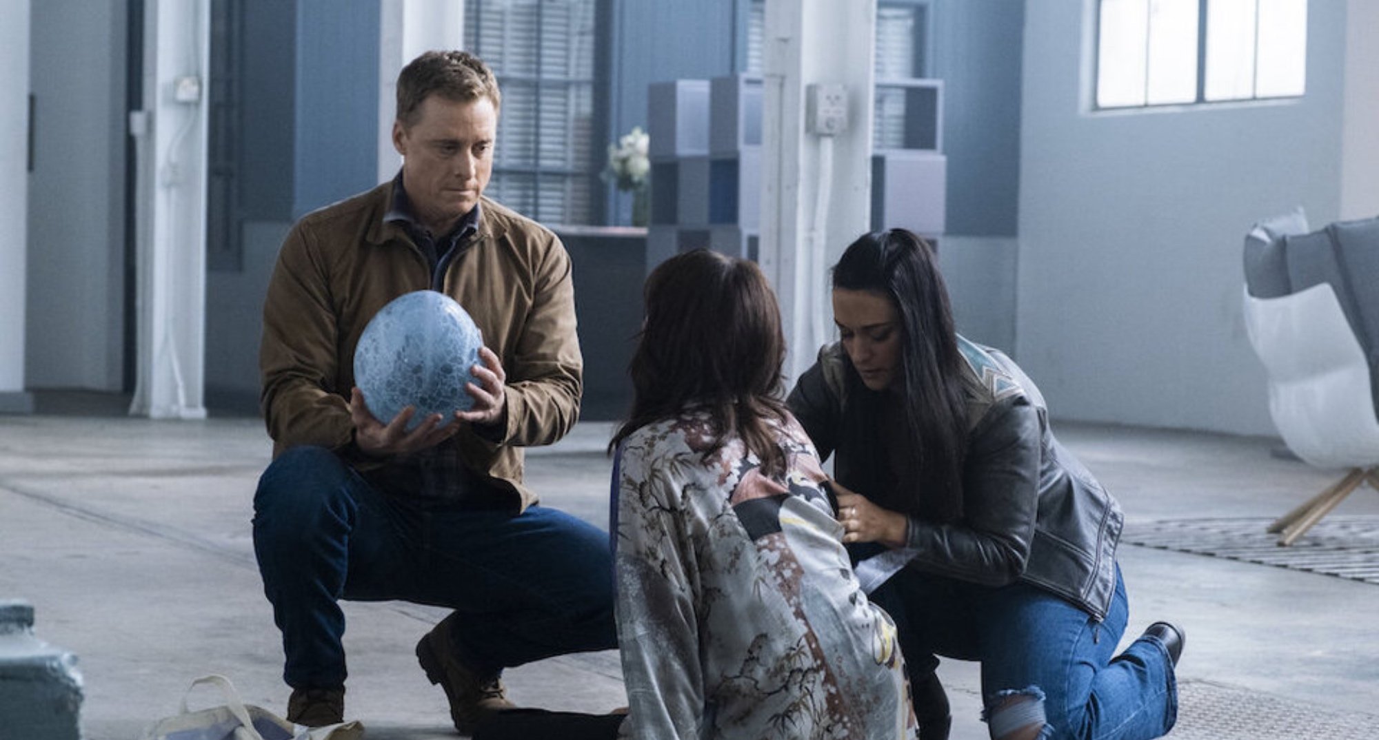 Harry, Asta and Violinda in 'Resident Alien' Season 2 with alien egg in relation to mid-season finale.