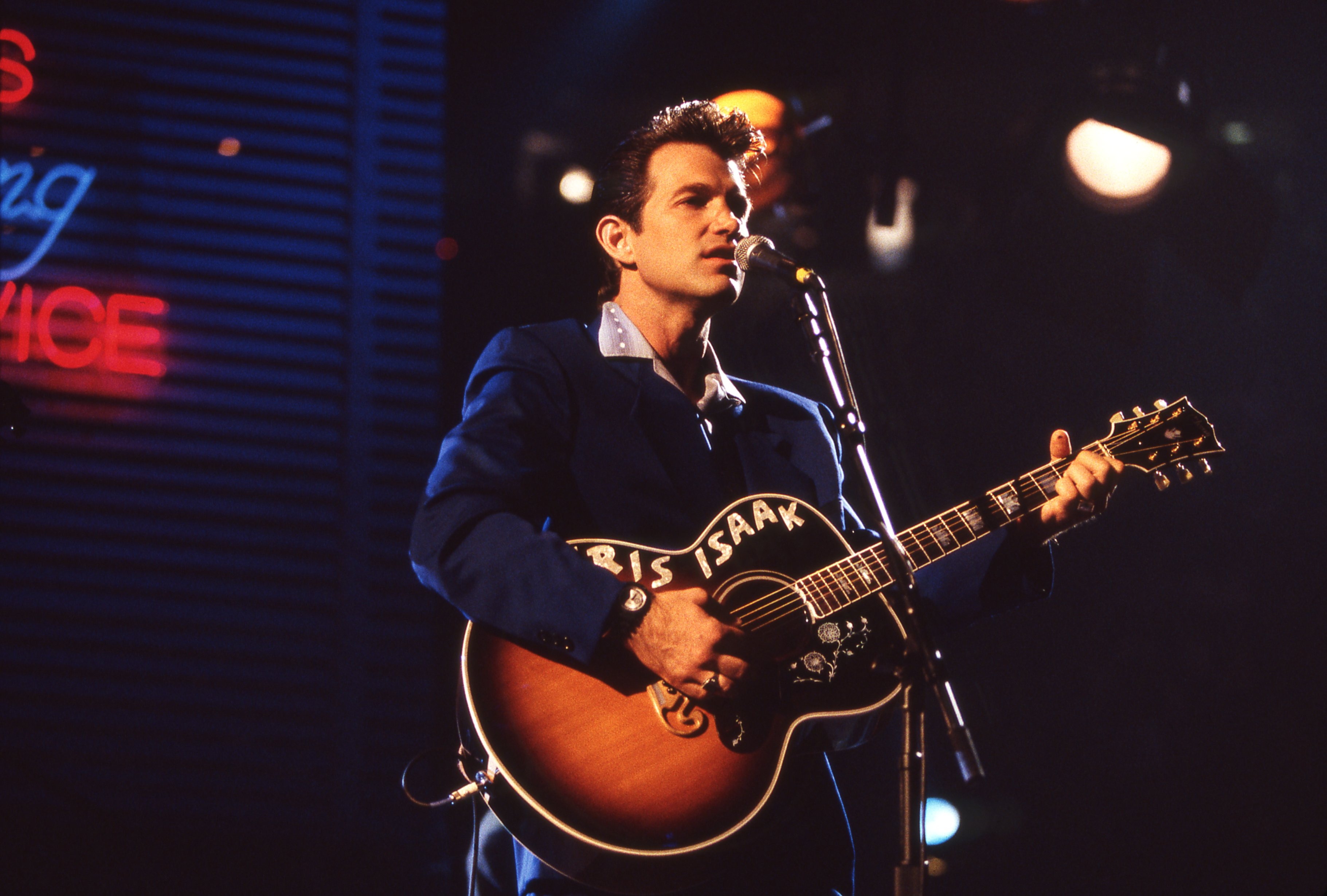 Chris Isaak with a guitar