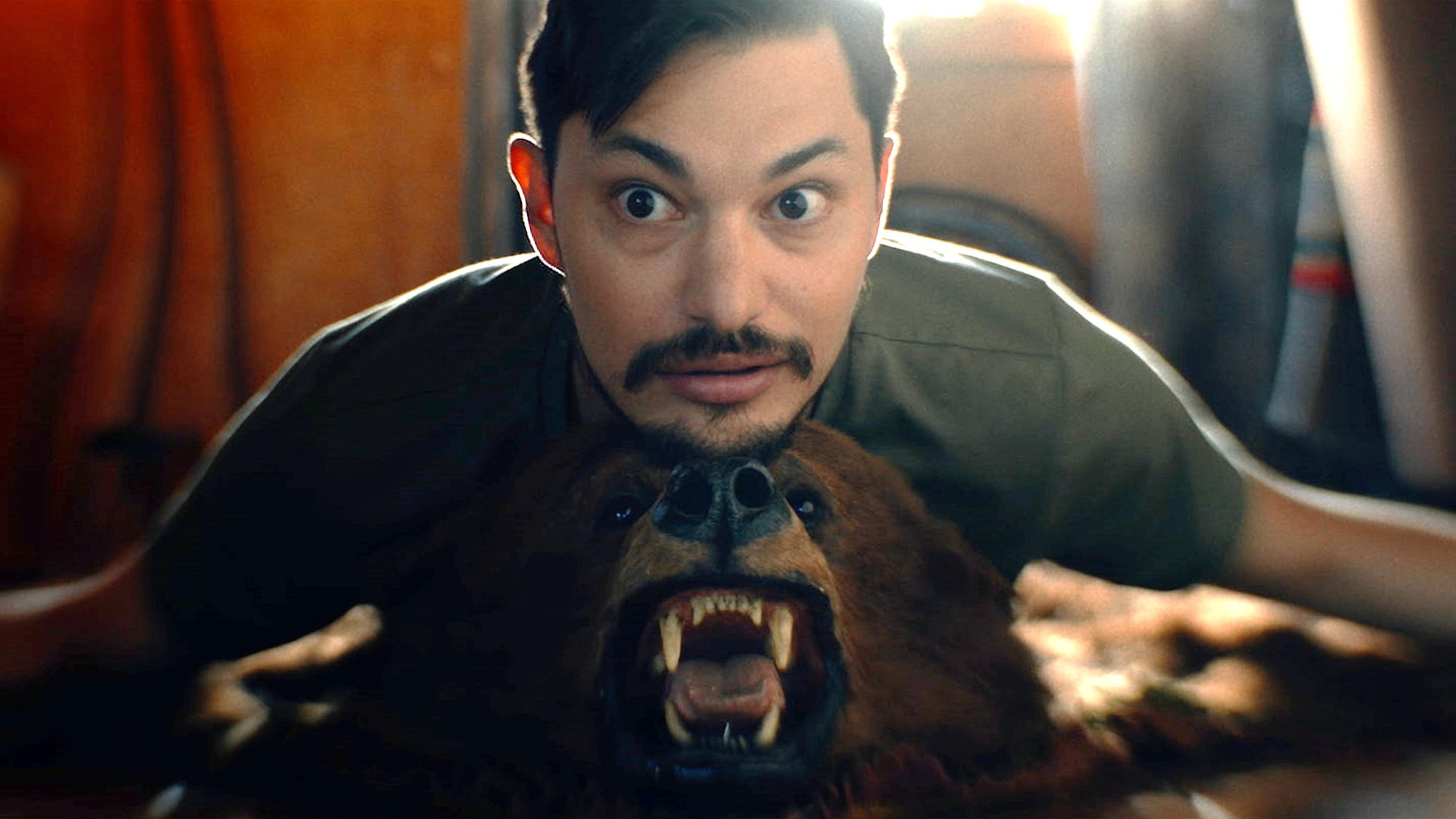 'Hypochondriac' Zach Villa as Will resting his chin on top of a bear head mat
