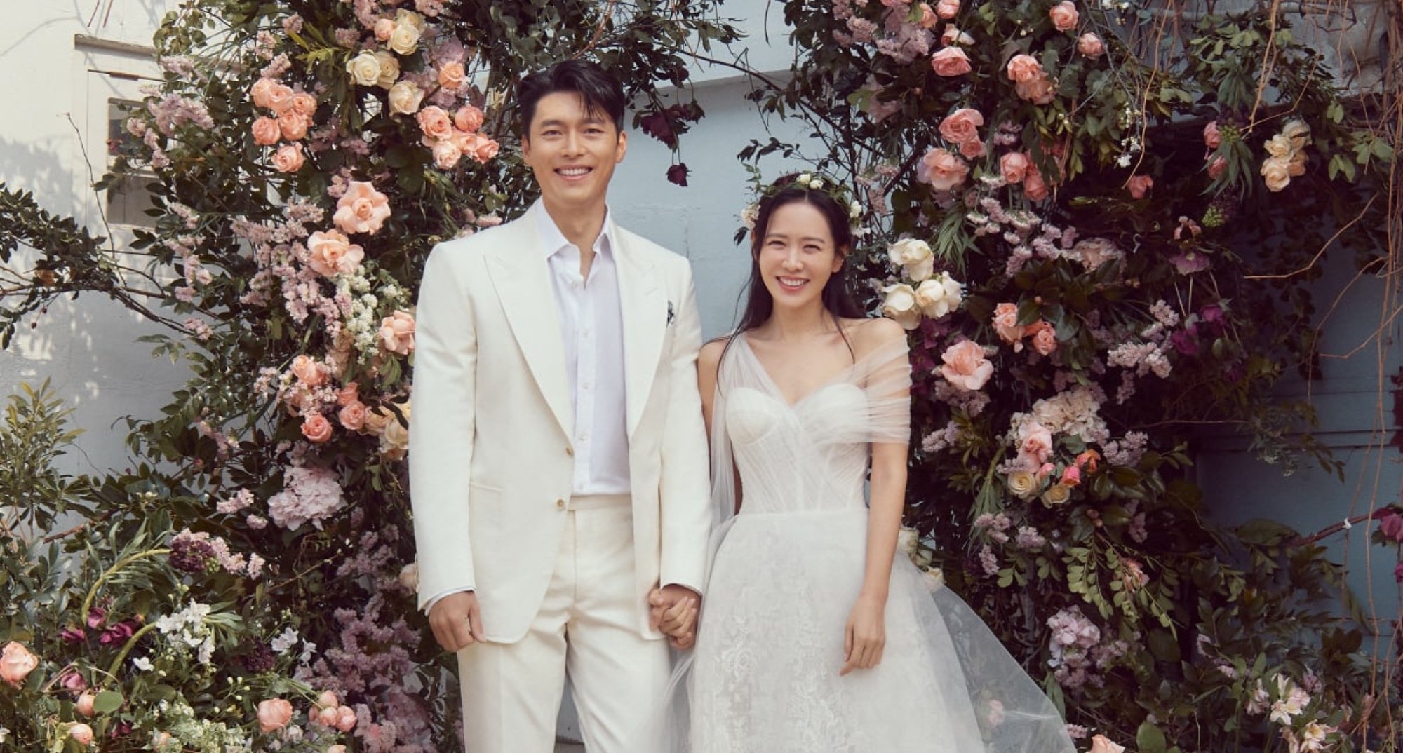 Hyun Bin and Son Ye-jin wedding photos wearing white dress and suit.