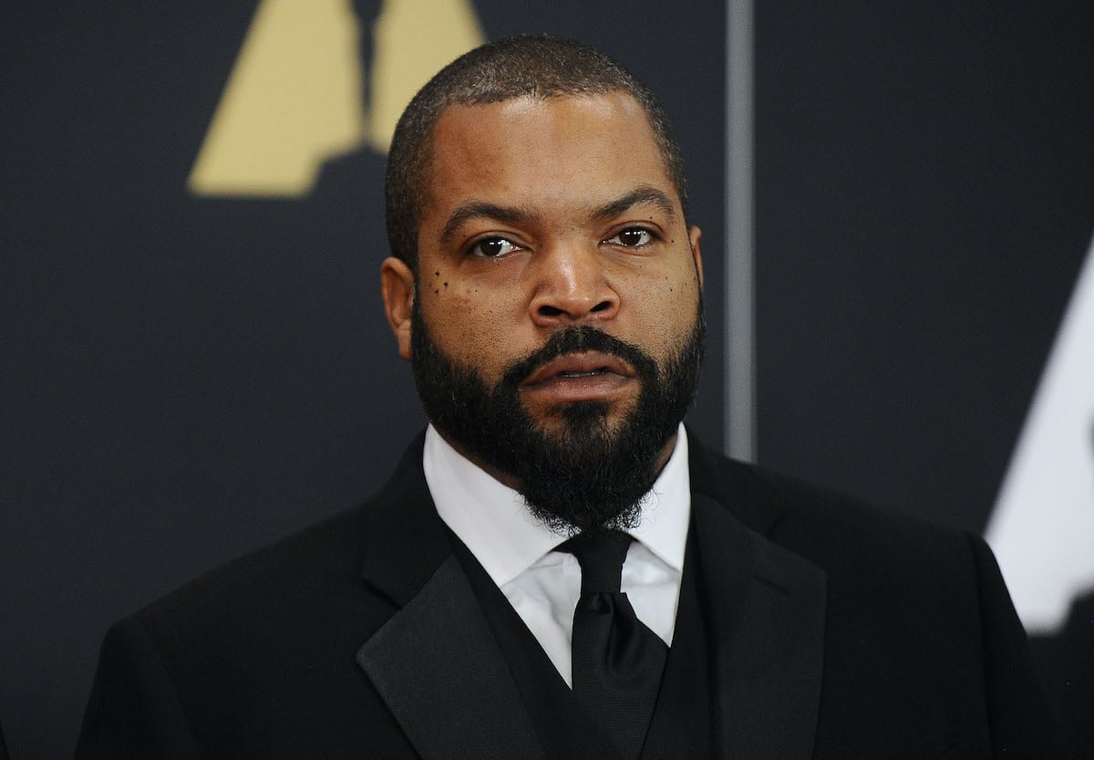 Ice Cube wears a suit and poses
