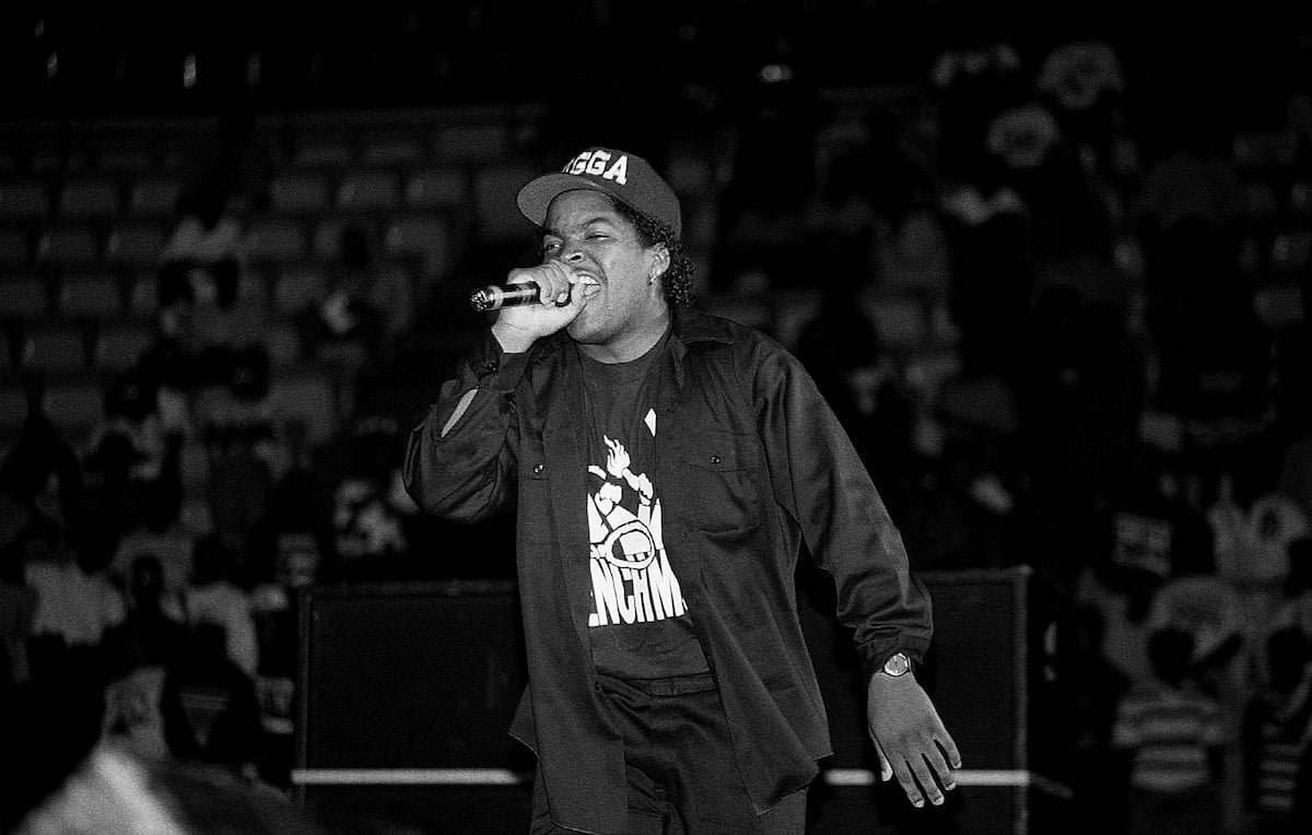 Ice Cube performs onstage with a microphone in his hand