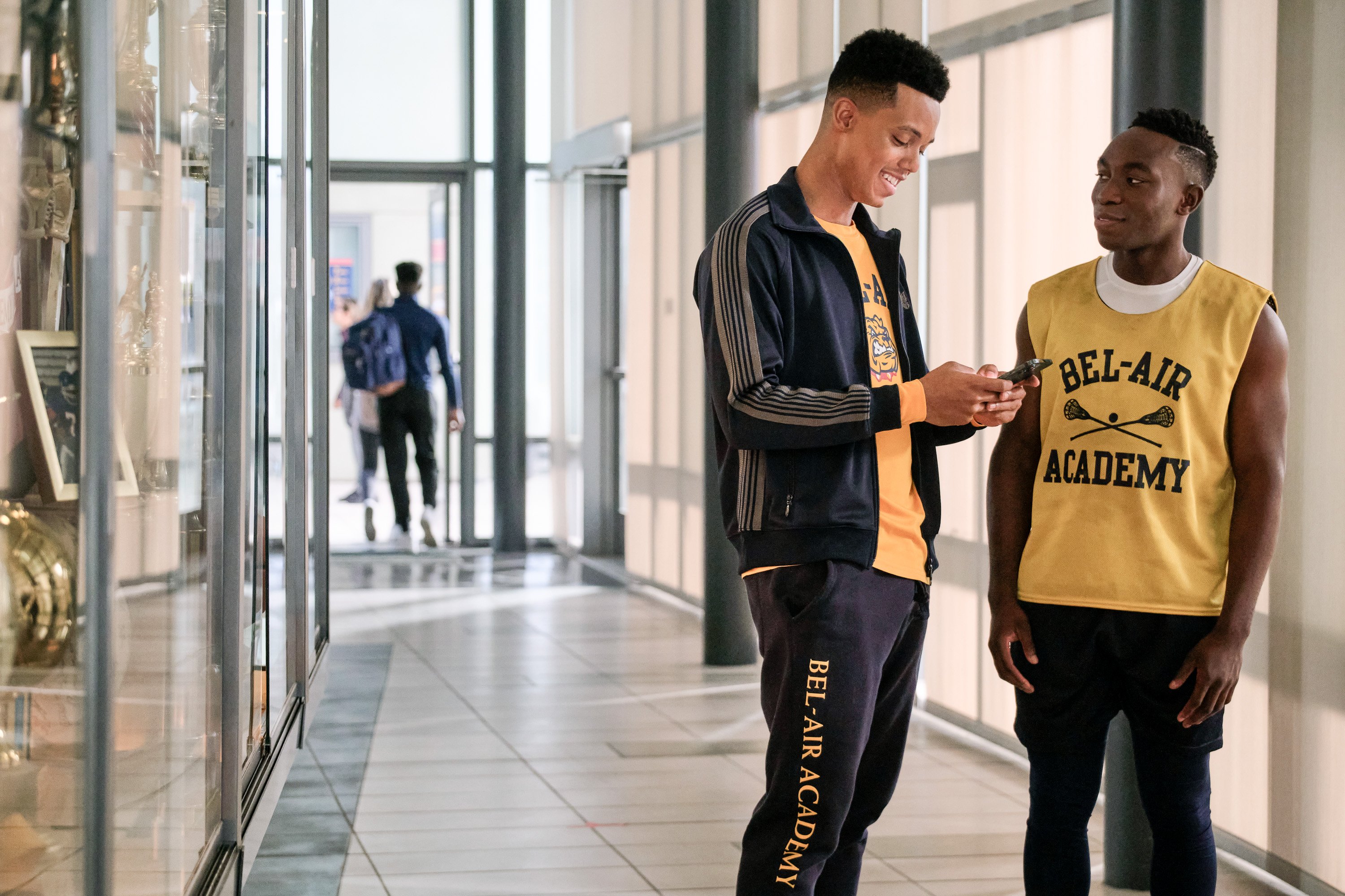 Jabari Banks and Olly Sholotan talking to each other during an episode of 'Bel-Air'