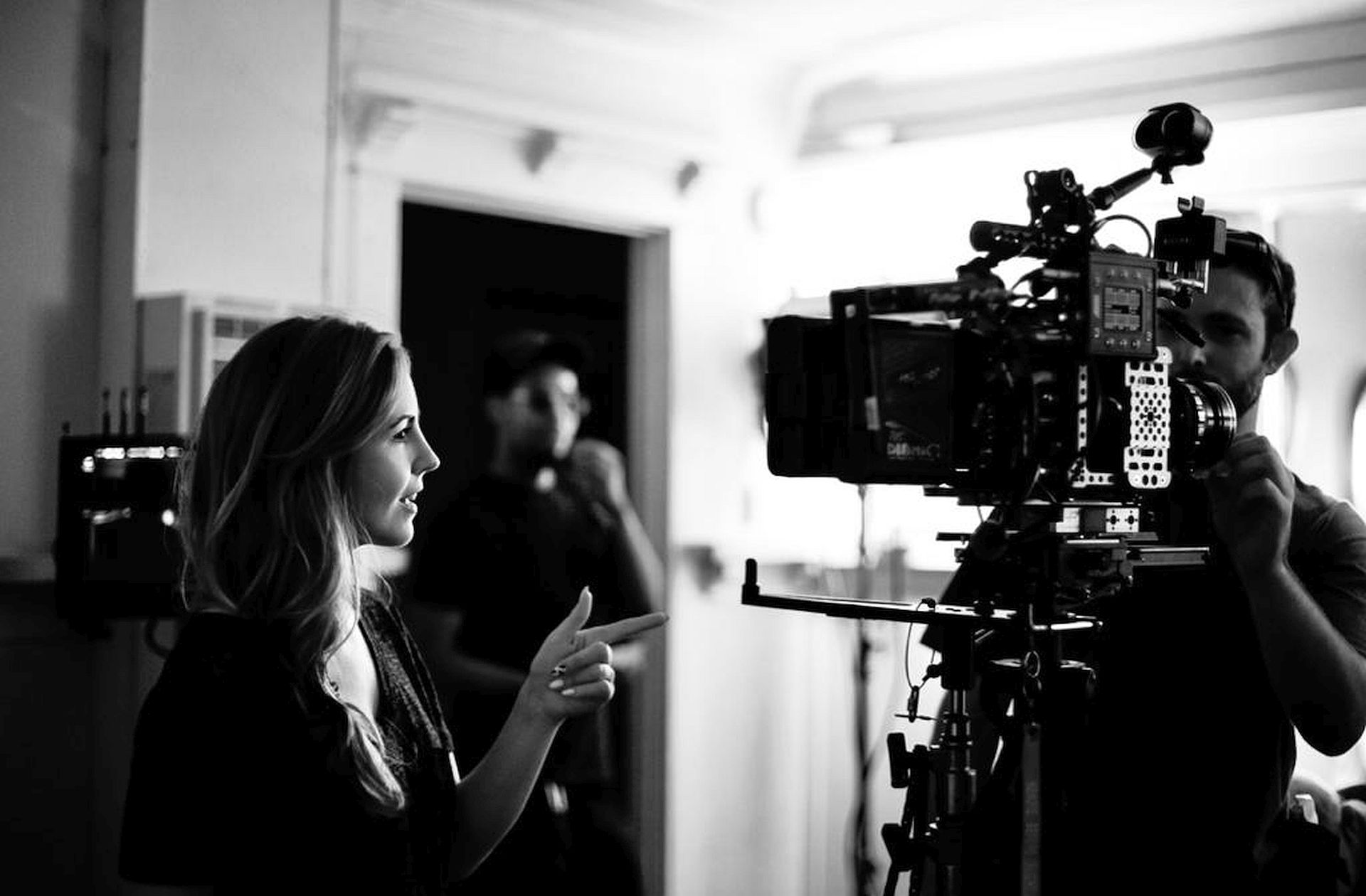 A black-and-white photo of producer Jamee Ranta on set