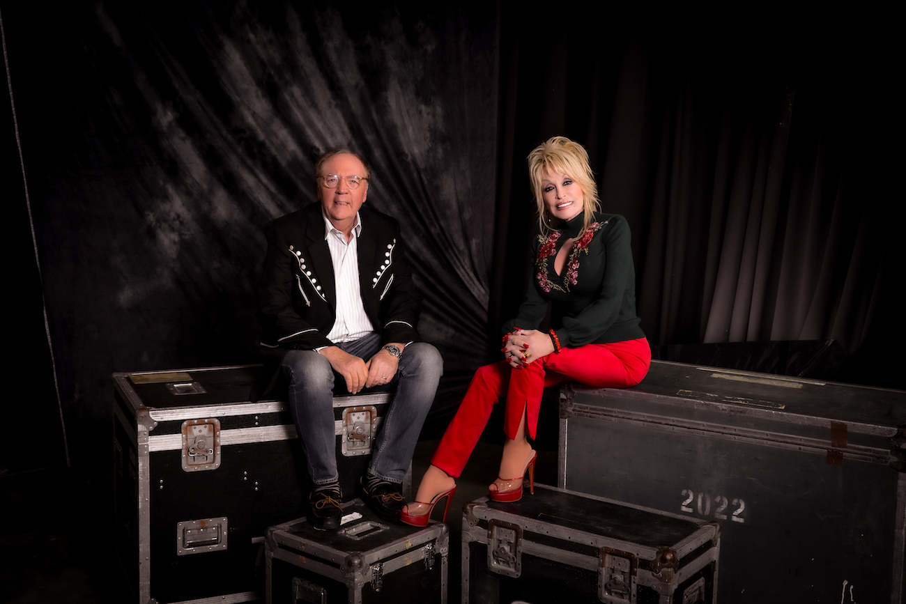 James Patterson and Dolly Parton posing for a portrait to promote their new book, 'Run, Rose, Run,' in 2022.