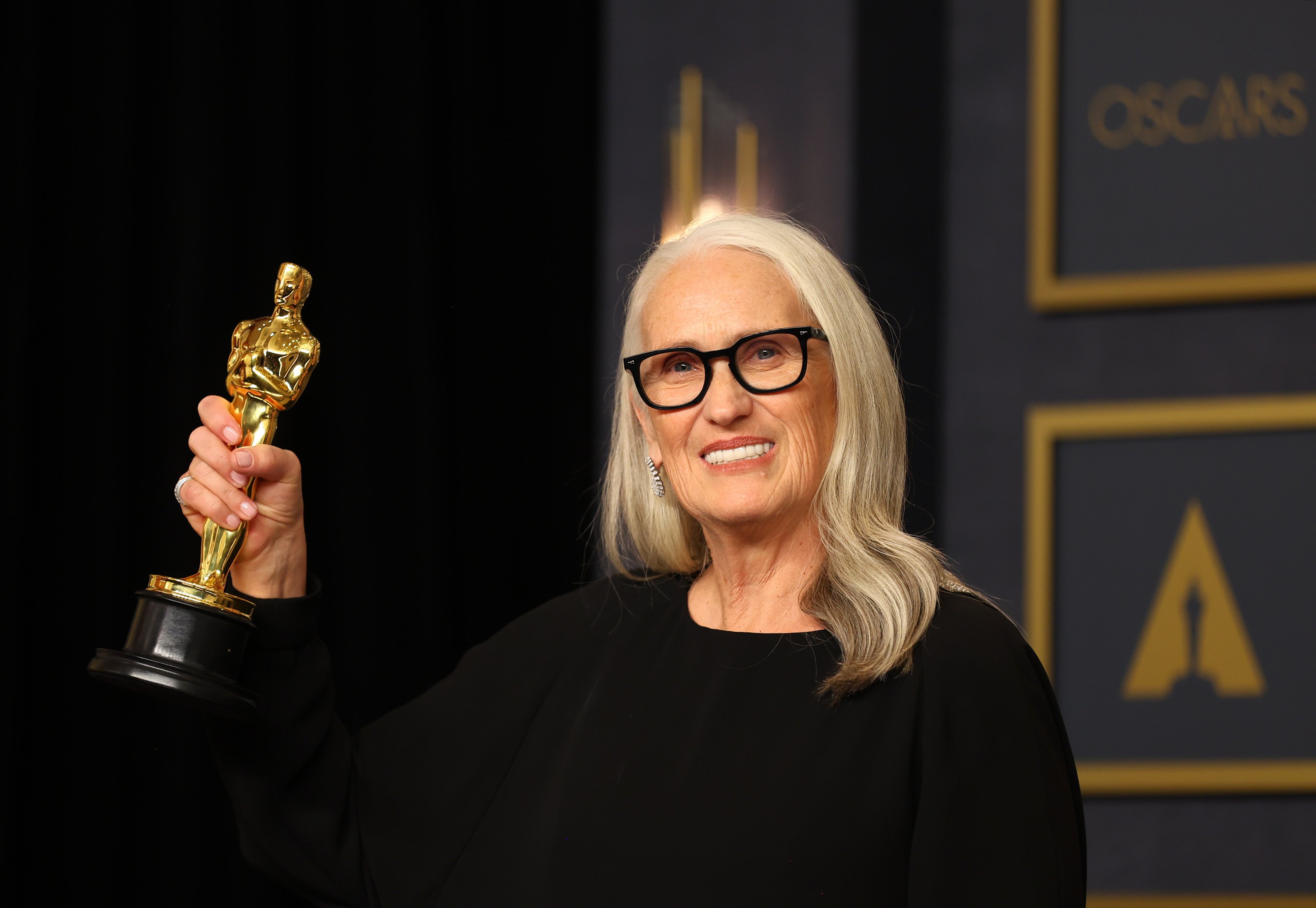 Jane Campion holds her Best Director Oscar for The Power of the Dog