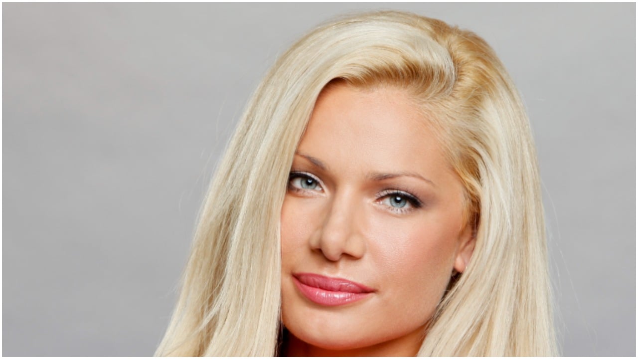 Janelle Pierzina posing for 'Big Brother 14' cast photo
