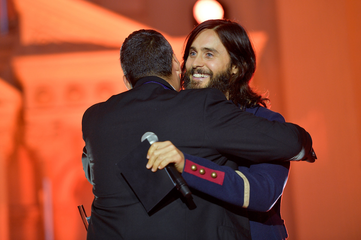 Mike Elizondo accepts award from Jared Leto onstage at Spotify's Inaugural Secret Genius Awards in 2017