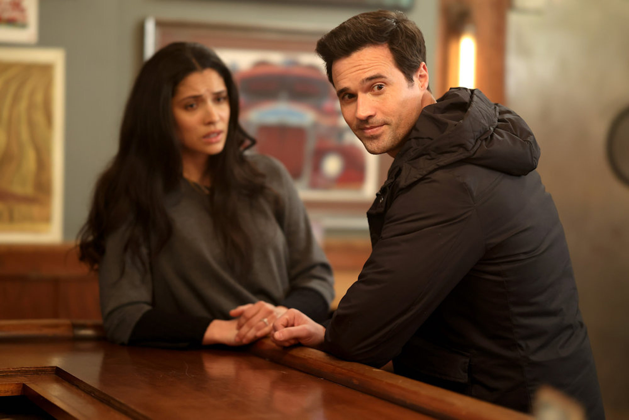 Miranda Rae Mayo as Stella Kidd and Brett Dalton as Jason Pelham talking to each other in a bar in 'Chicago Fire' Season 10 Episode 14