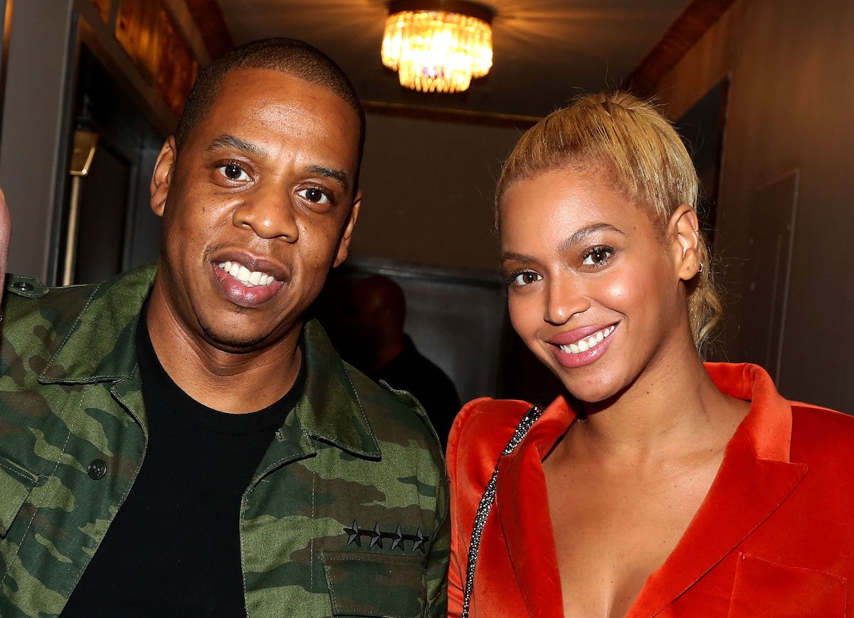 Jay-Z and Beyonce smile for the camera.