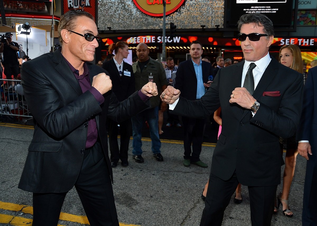 Jean Claude Van Damme posing with Sylvester Stallone.