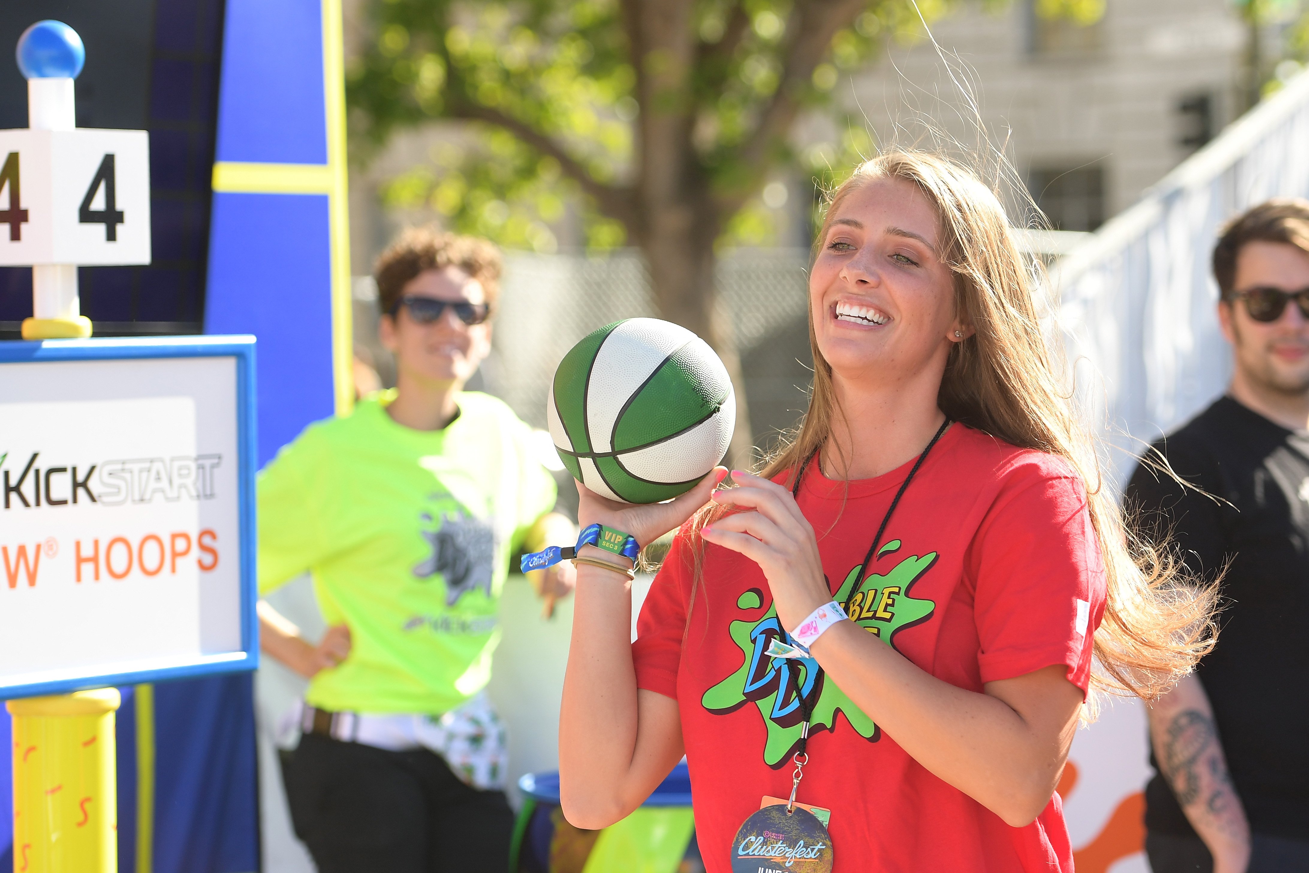 Jenna Compono holding a green and white ball