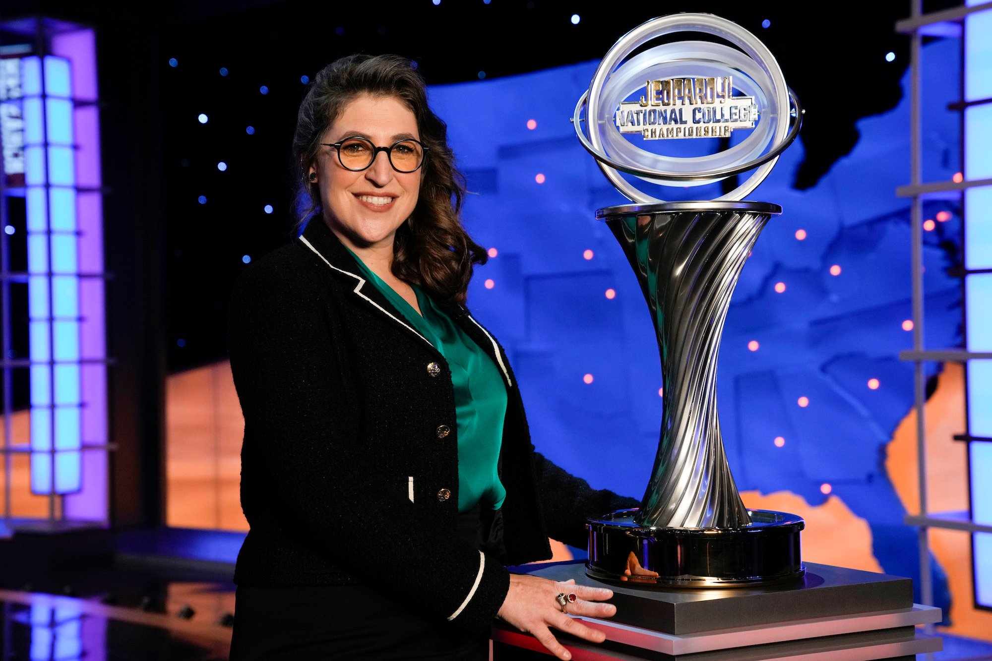 'Jeopardy!' host Mayim Bialik poses with the college trophy