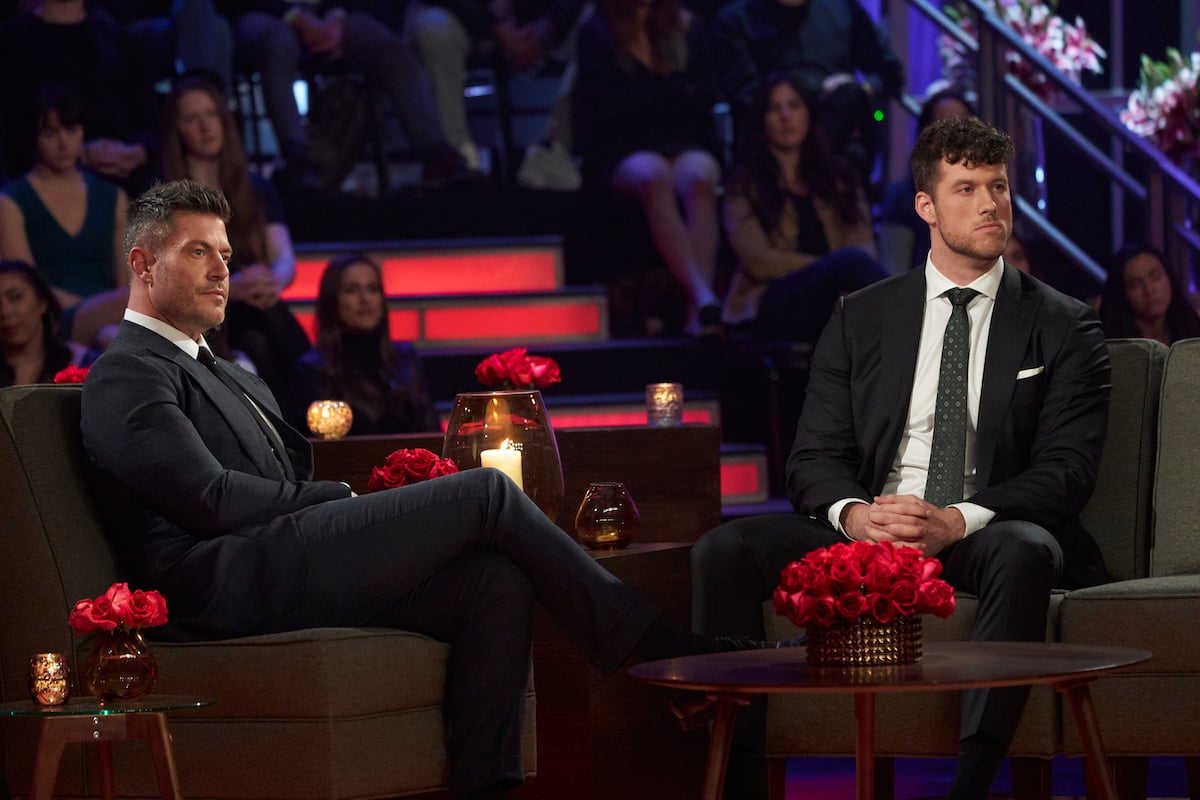 Host Jesse Palmer and Clayton Echard sit on the stage during The Bachelor's Season 26's Women Tell All segment