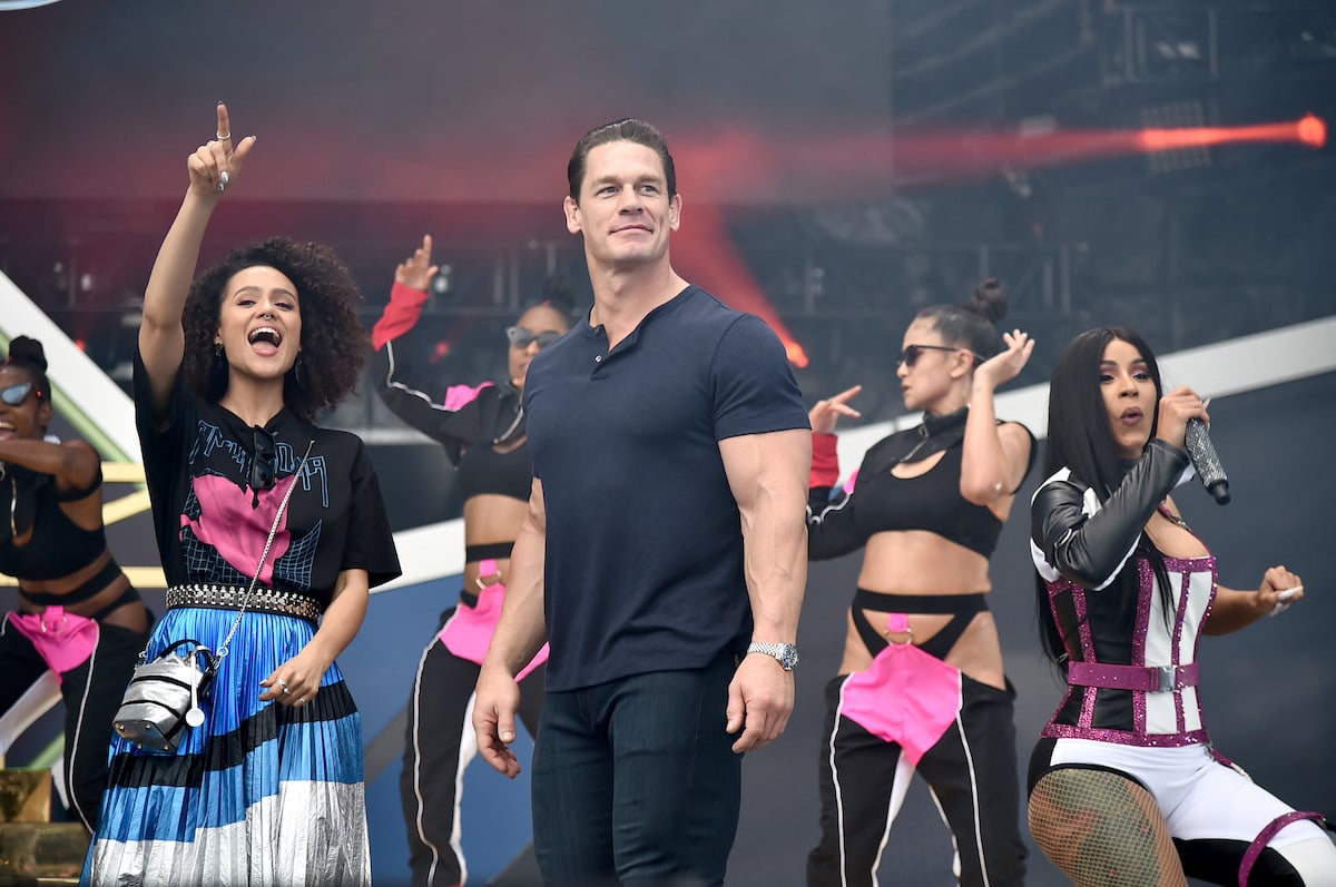 Nathalie Emmanuel and John Cena stand onstage during The Road To F9 Concert