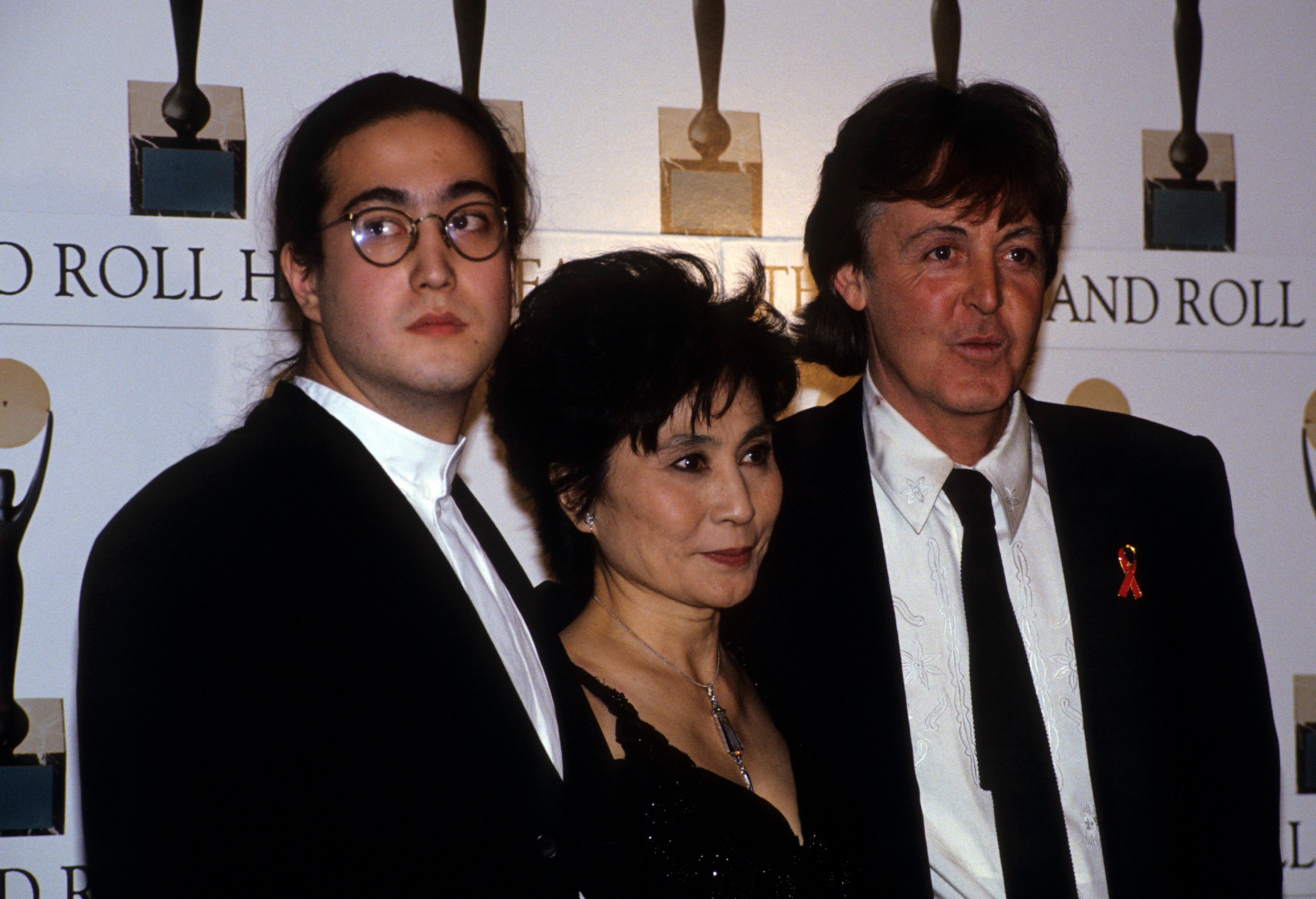 Sean Ono Lennon, Yoko Ono, and Paul McCartney wearing black