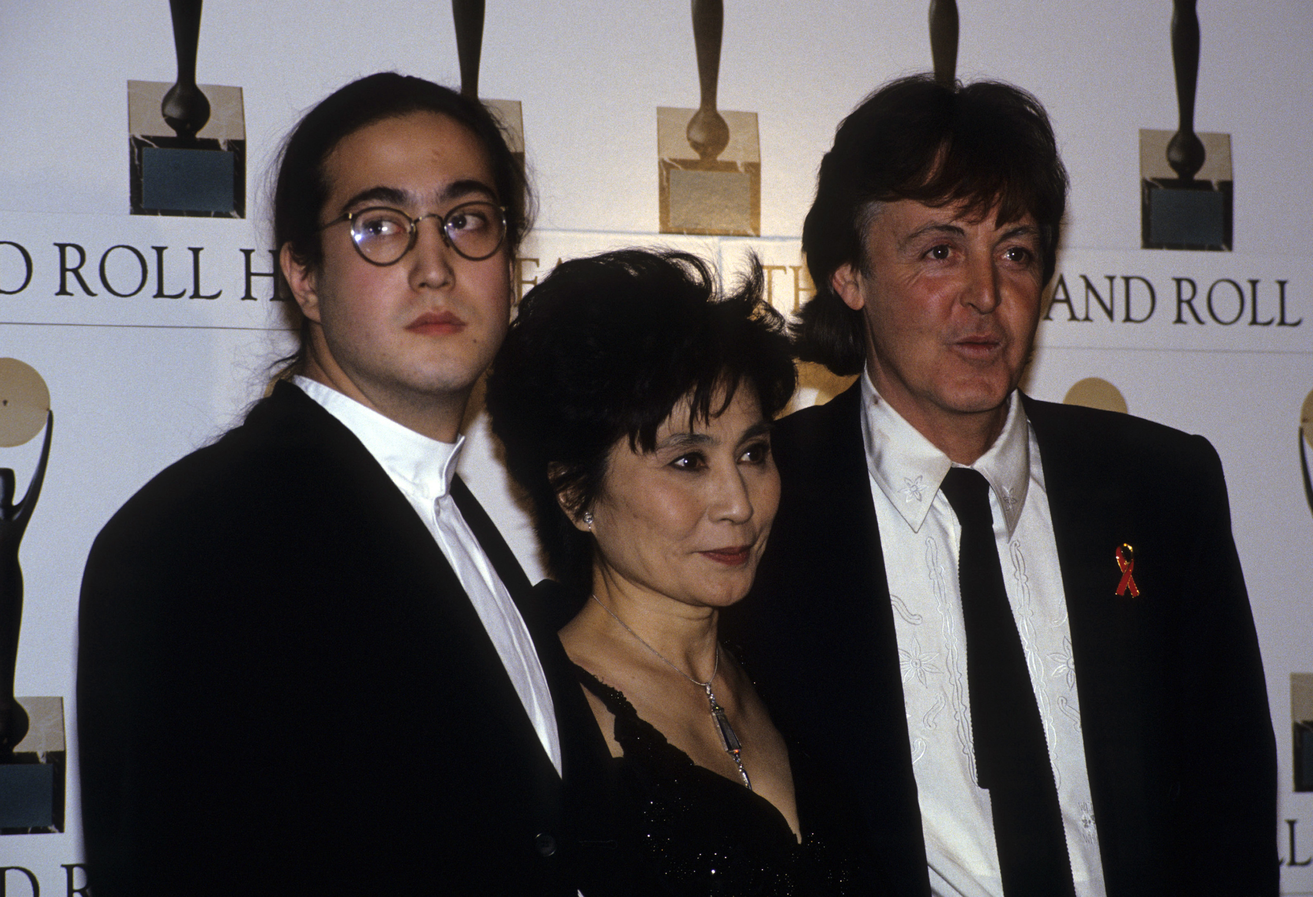 Sean Ono Lennon, Yoko Ono, and Paul McCartney wearing black