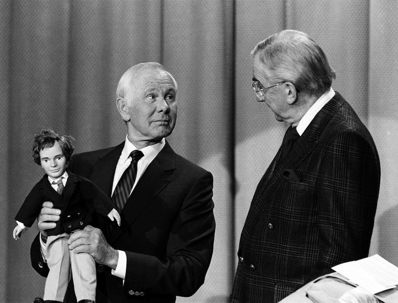 Johnny Carson holding a doll and looking at Ed McMahon on 'The Tonight Show' c. 1990