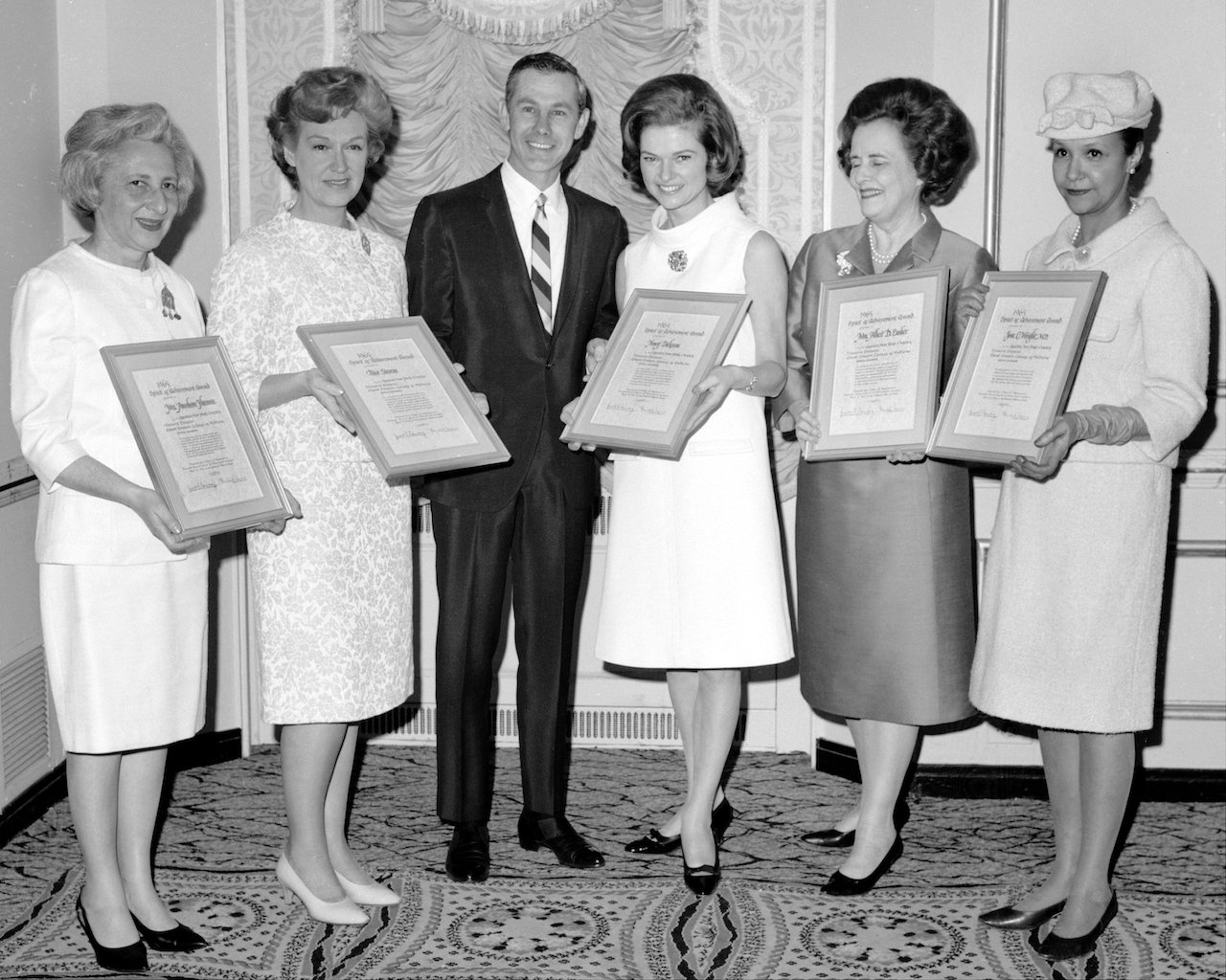 Johnny Carson presents the Spirit of Achievement awards to a group of distinguished women c. 1965