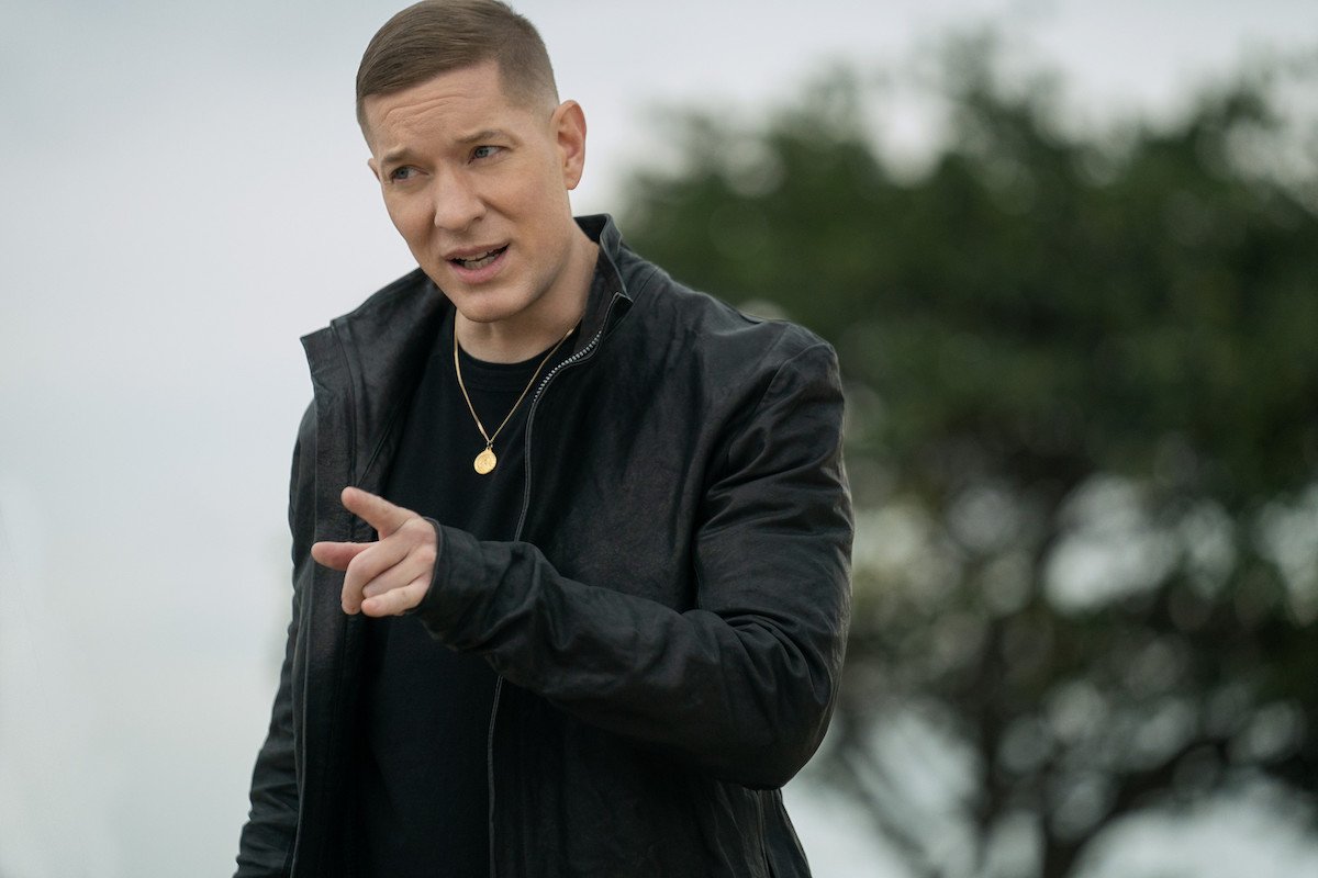 Joseph Sikora as Tommy Egan wearing all black and pointing in 'Power Book IV: Force'