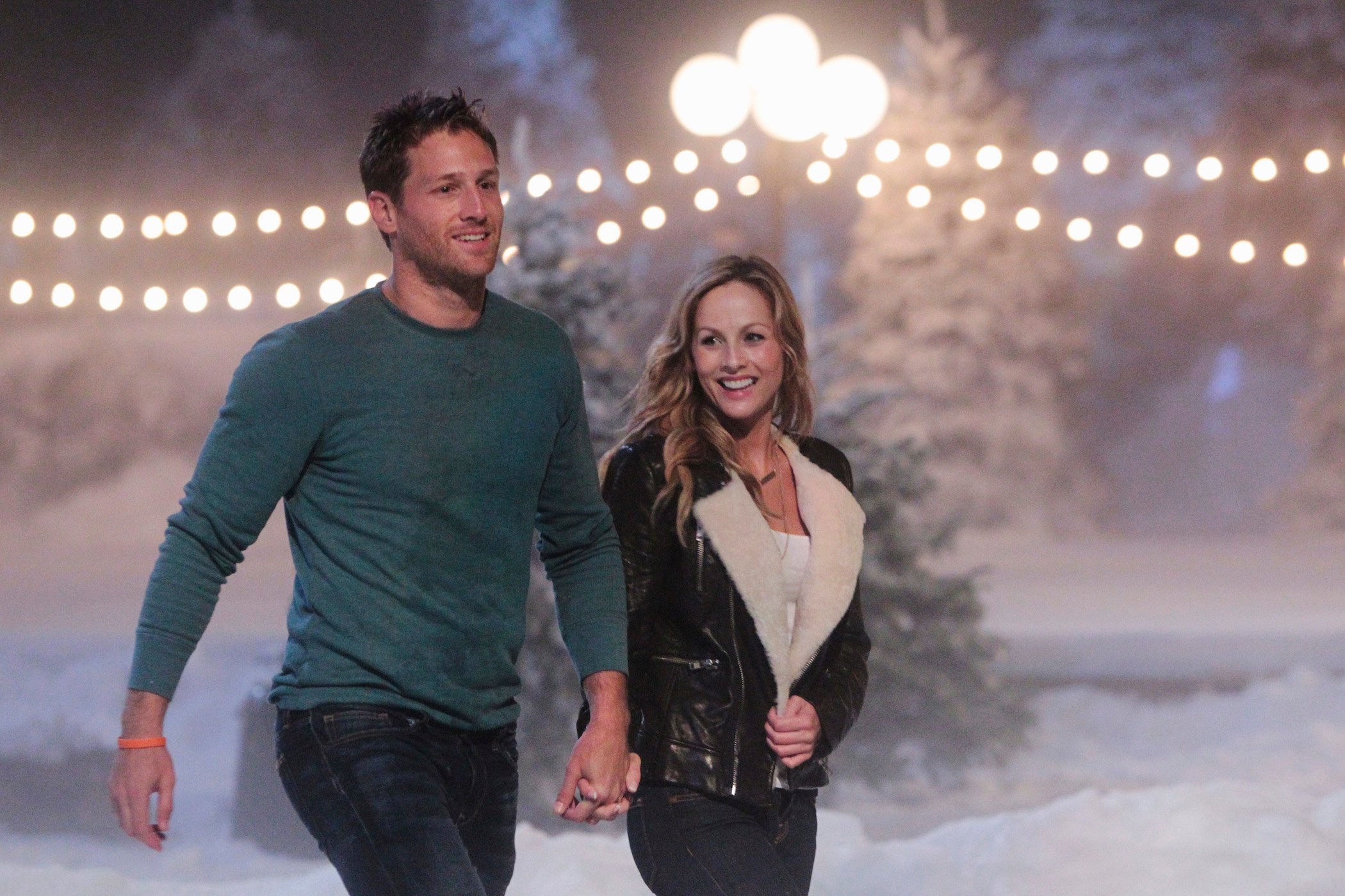 Juan Pablo Galavis and Clare Crawley walking together and smiling on 'The Bachelor'