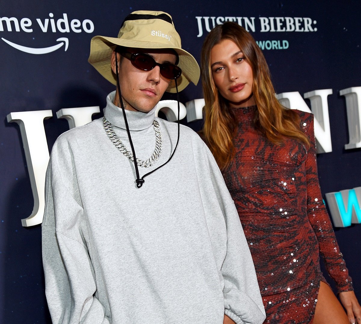 Justin Bieber and Hailey Bieber pose for a photo on the carpet at the Justin Bieber Our World event