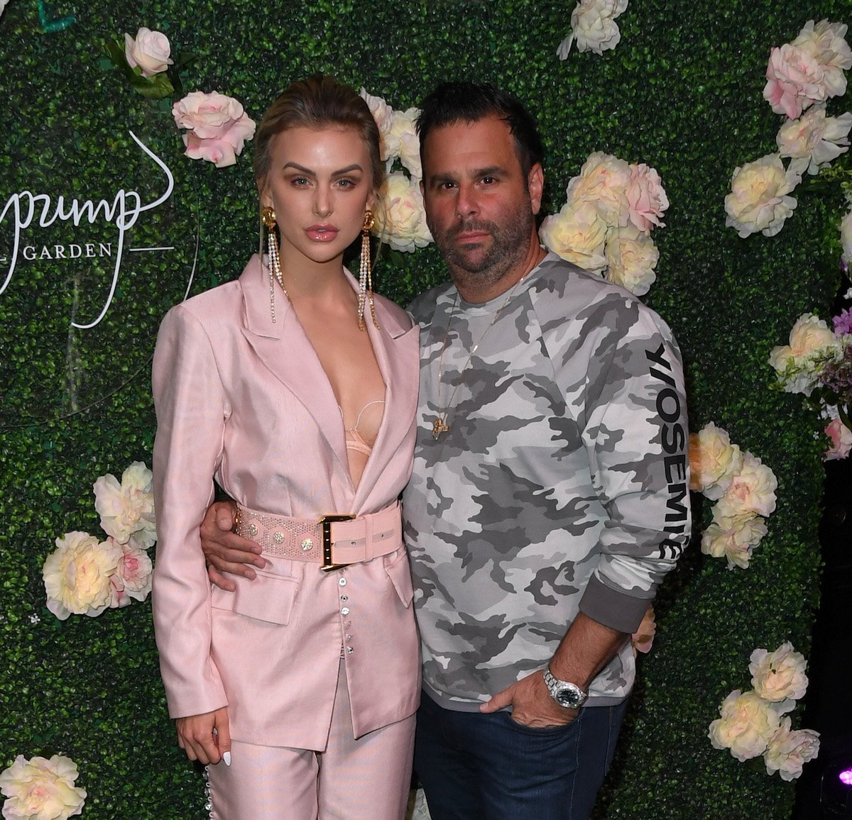 Lala Kent and Randall Emmett pose together at an event.
