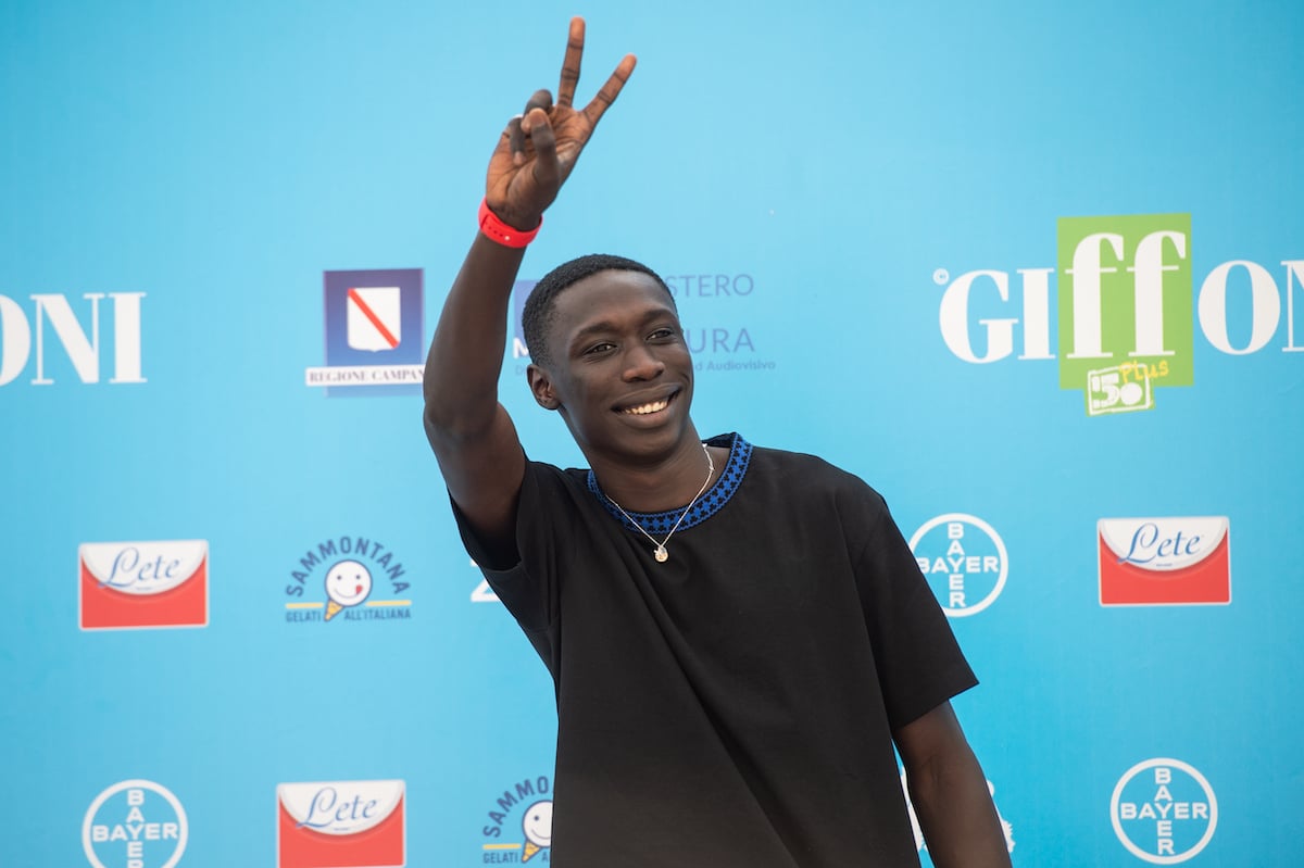 Khaby Lame holds up a peace sign at the 2021 Giffoni Film Festival