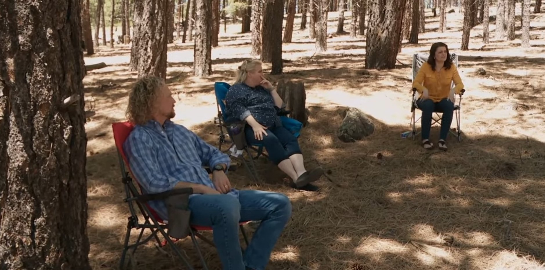 Kody Brown, Janelle Brown, and Robyn Brown sitting together on Coyote Pass property in Flagstaff, Arizona on 'Sister Wives'.