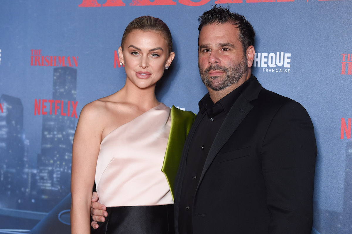 Lala Kent and Randall Emmett pose together at an event.