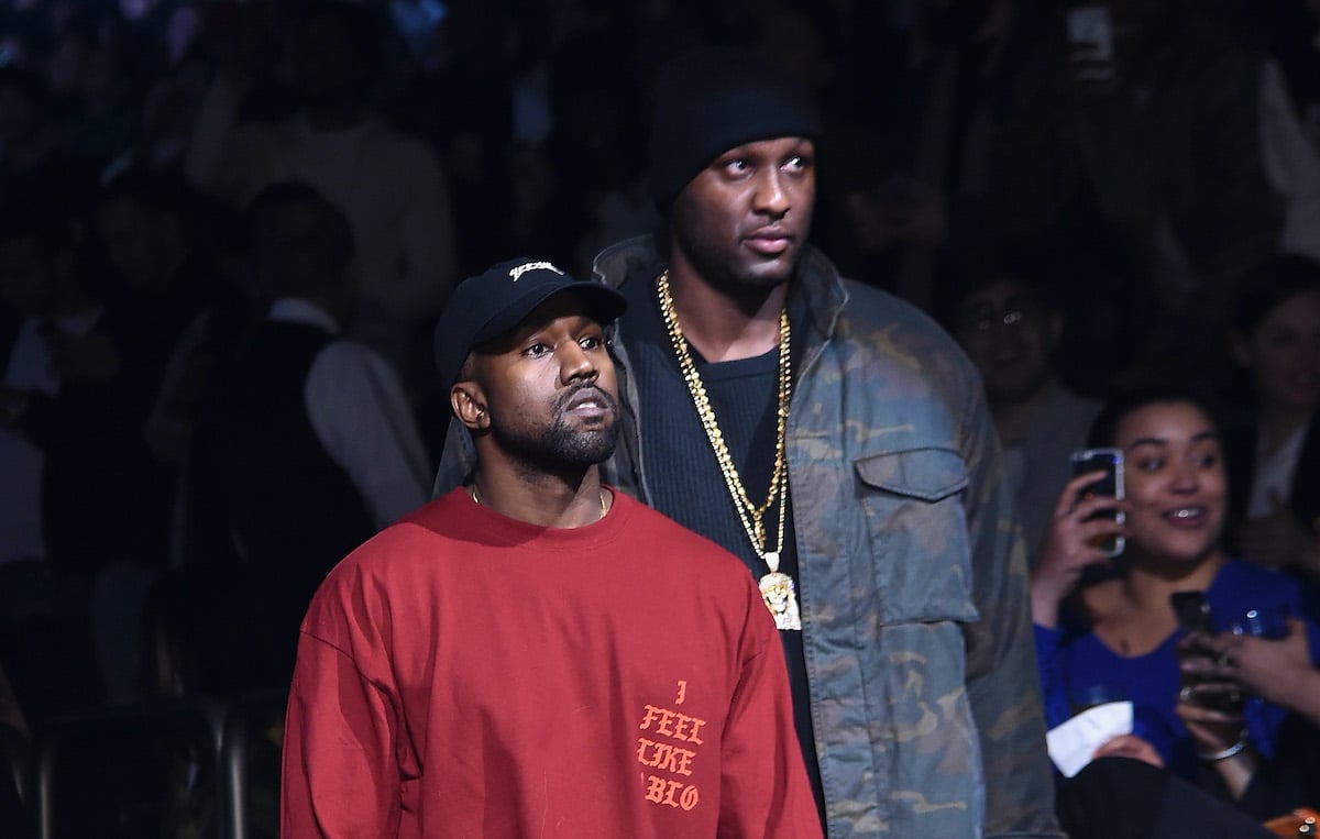 Kanye West and Lamar Odom walking through a crowd
