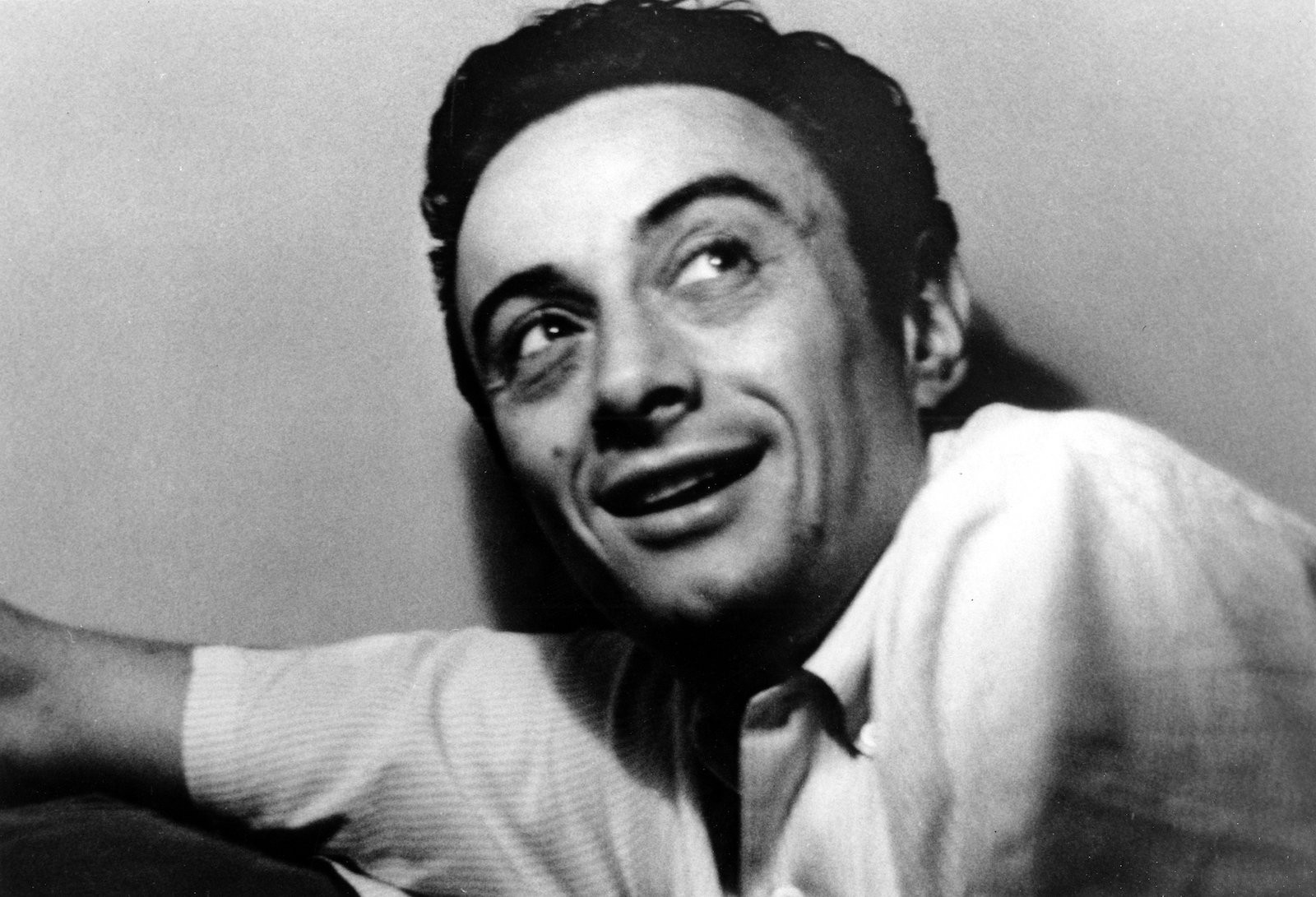 Lenny Bruce is seen smiling 