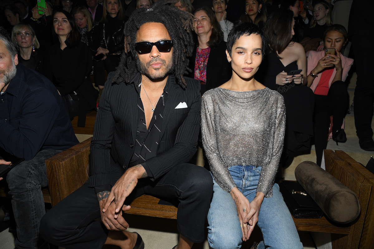 Lenny Kravitz and Zoe Kravitz sit together at an event.