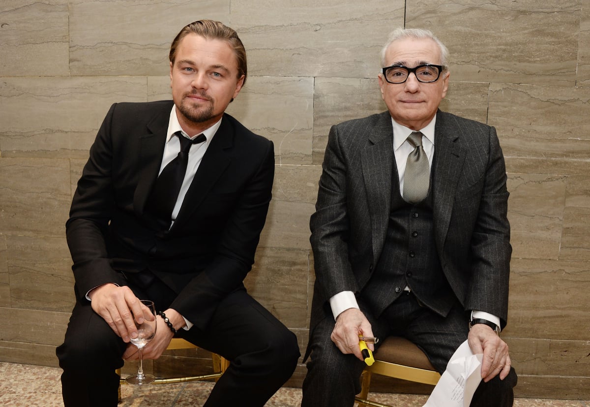 Leonardo DiCaprio and filmmaker Martin Scorsese sitting down and wearing suits rehearse backstage at the 2014 National Board Of Review Awards Gala at Cipriani 42nd Street on January 7, 2014
