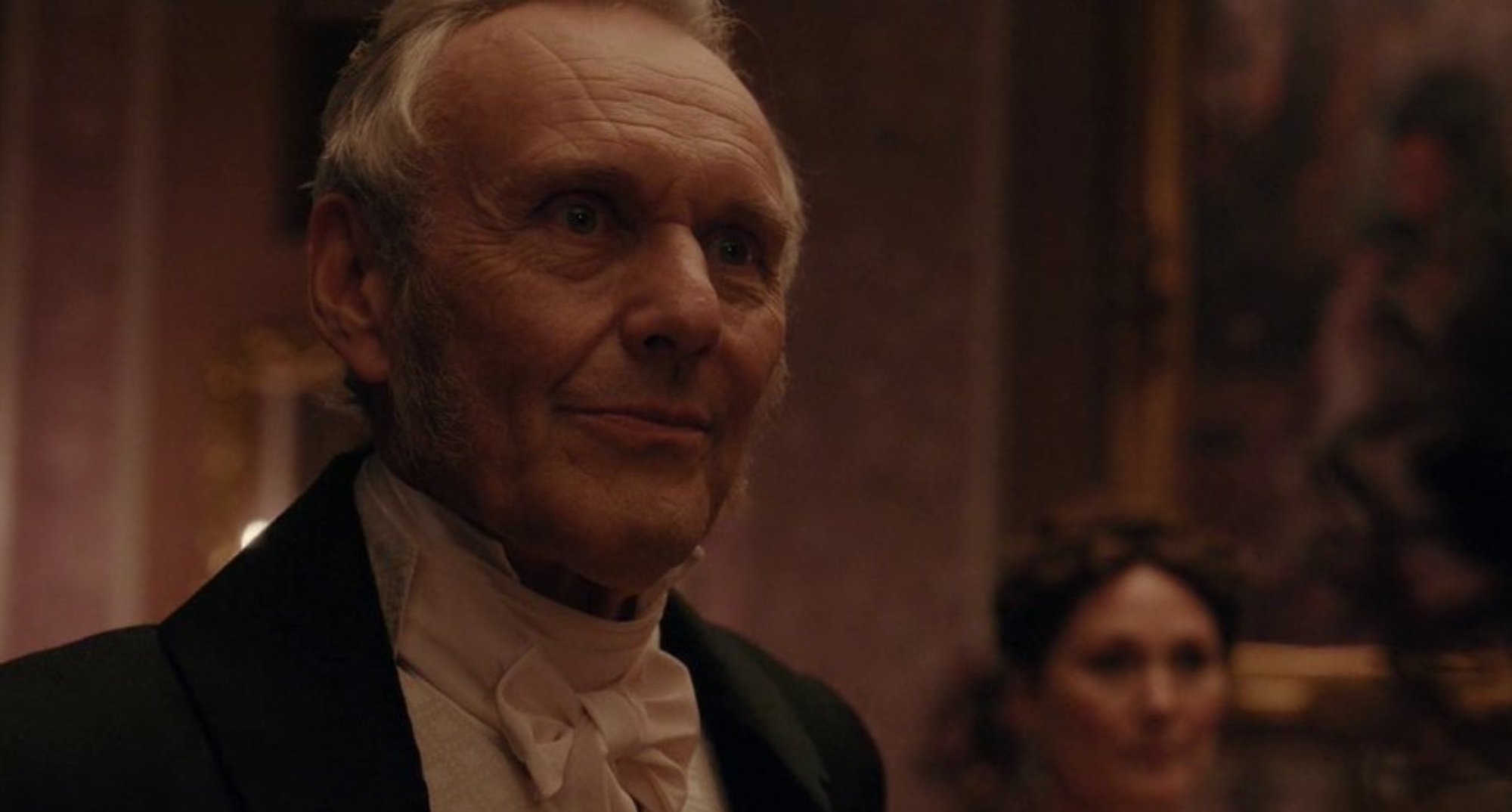 Lord Sheffield in 'Bridgerton' Season 2 wearing suit at dinner.
