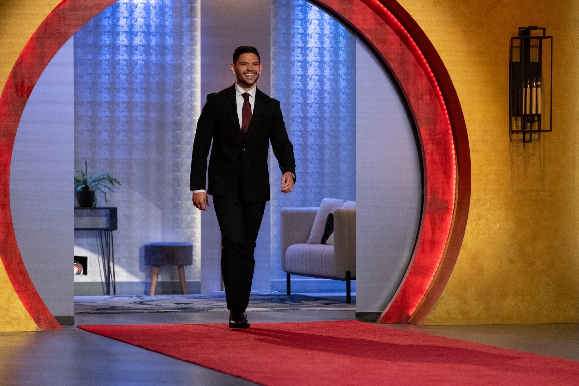 'Love is Blind' Season 2 contestant Kyle Abrams wearing a suit in a production still