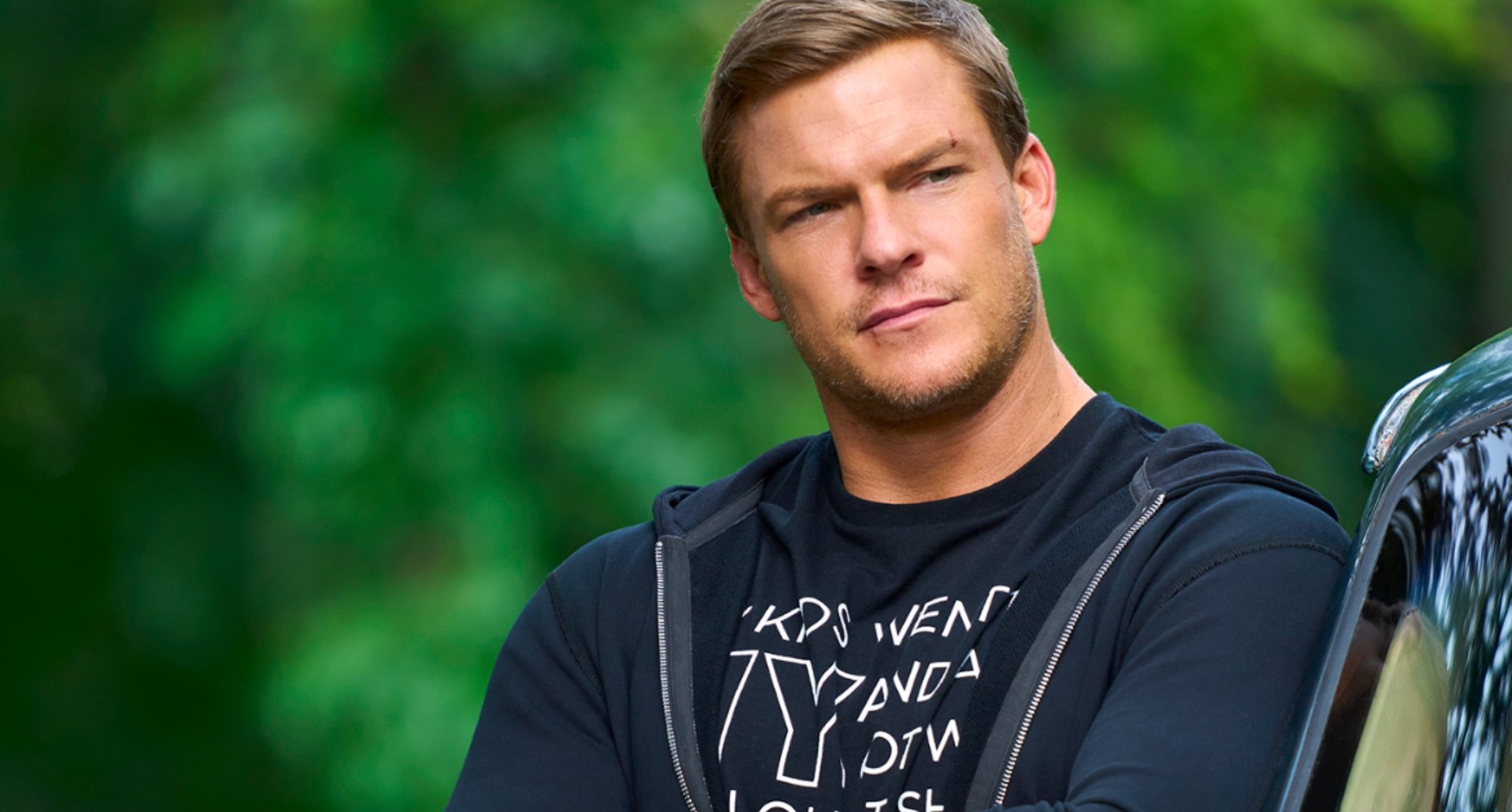 Main character Jack Reacher in 'Reacher' series wearing sweater and t-shirt.