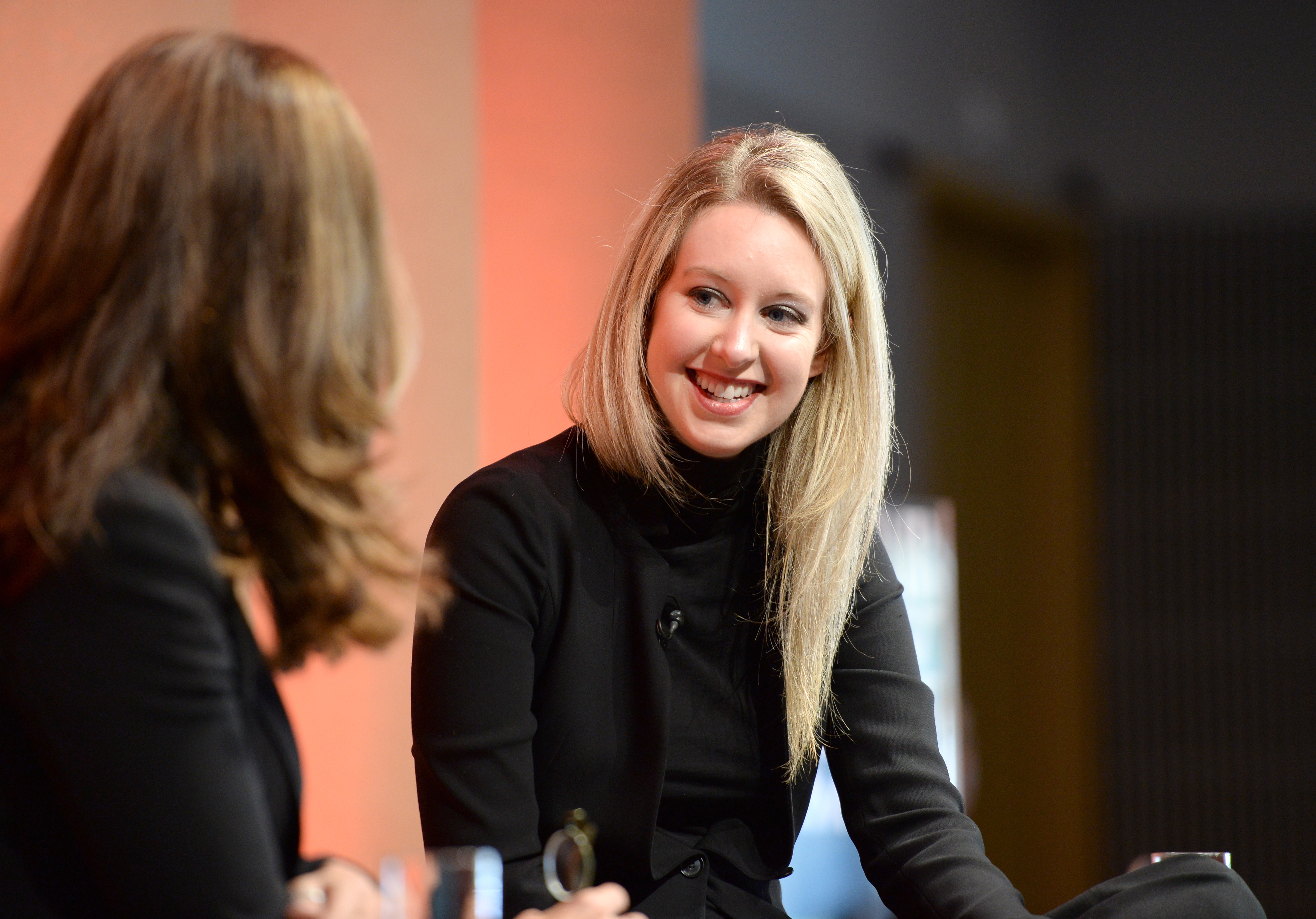 Elizabeth Holmes talking to Maria Shriver at Vanity Fair New Establishment Summit
