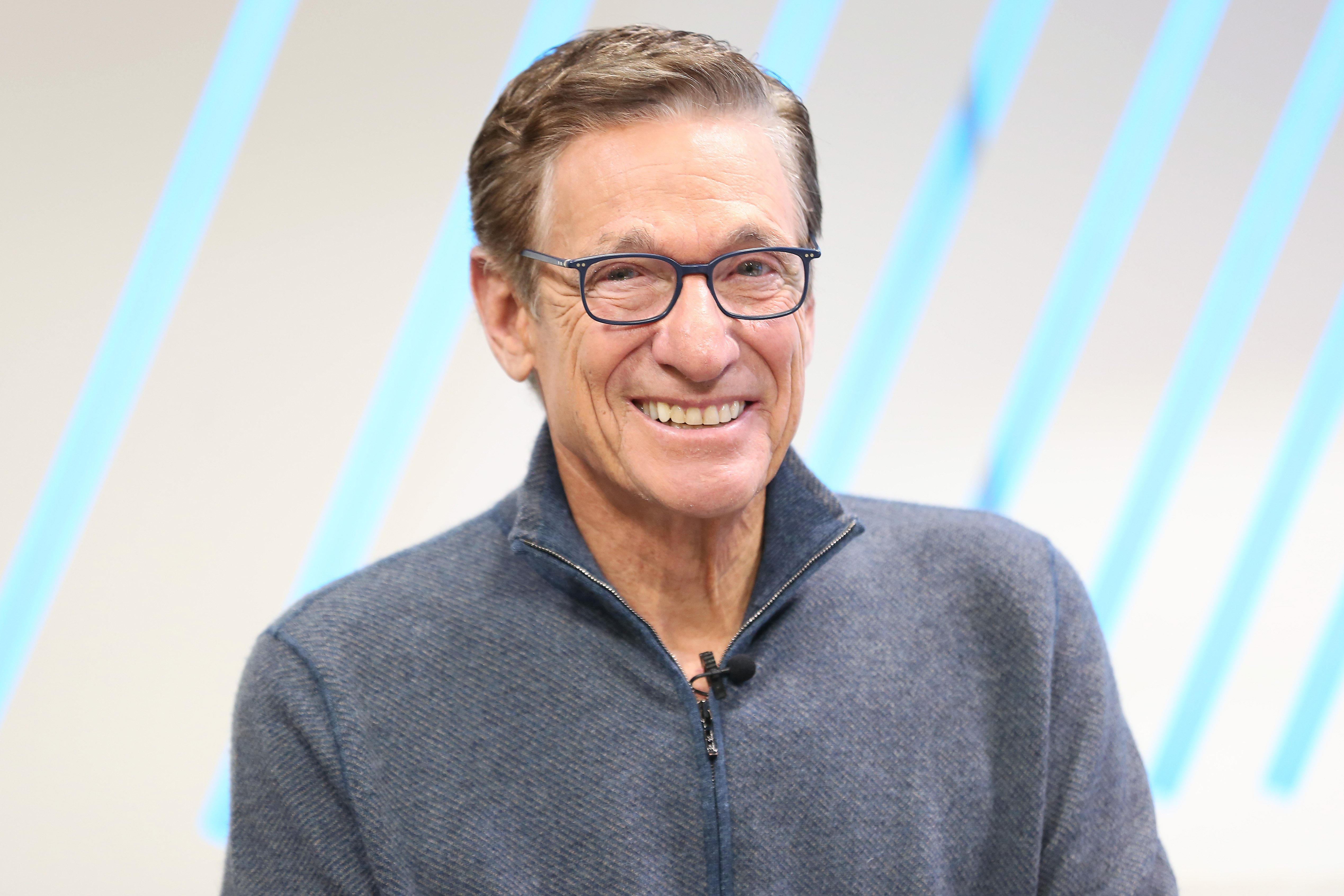 Maury Povich smiling during a visit to 'People Now'
