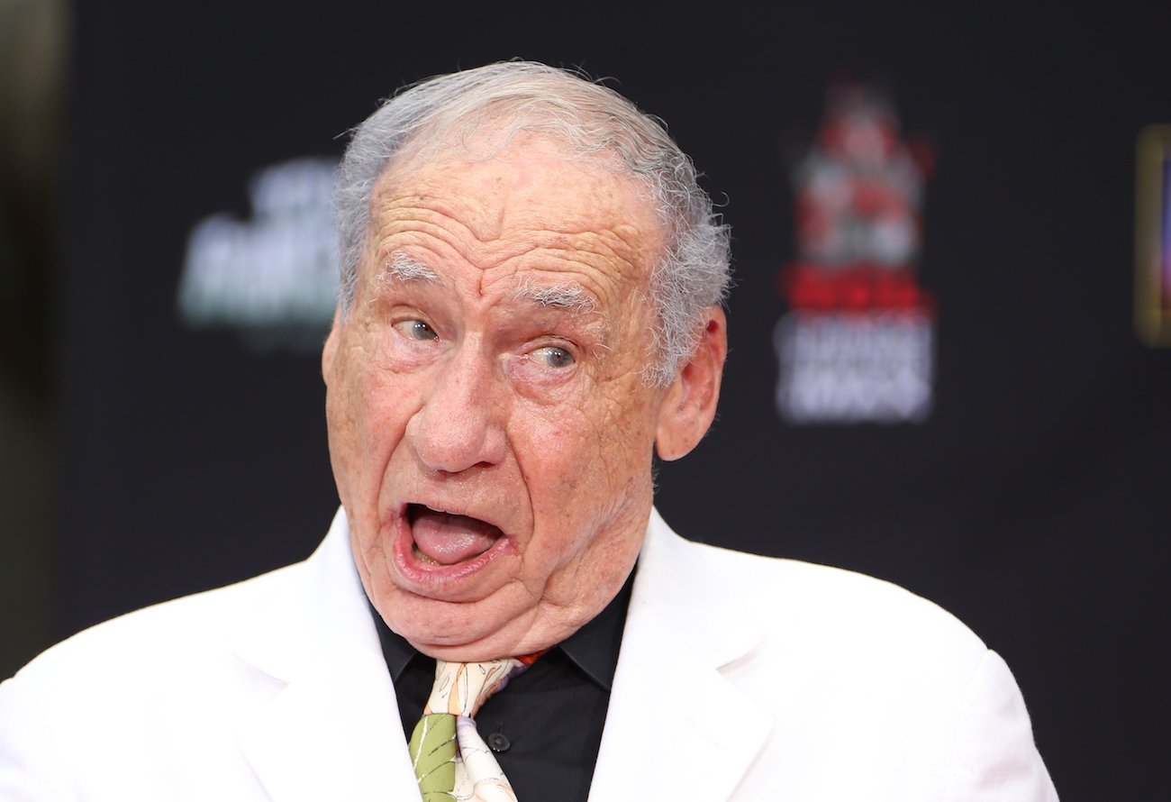 Mel Brooks in a white suit at a hand and foot ceremony at the TCL Chinese Theater in 2014.