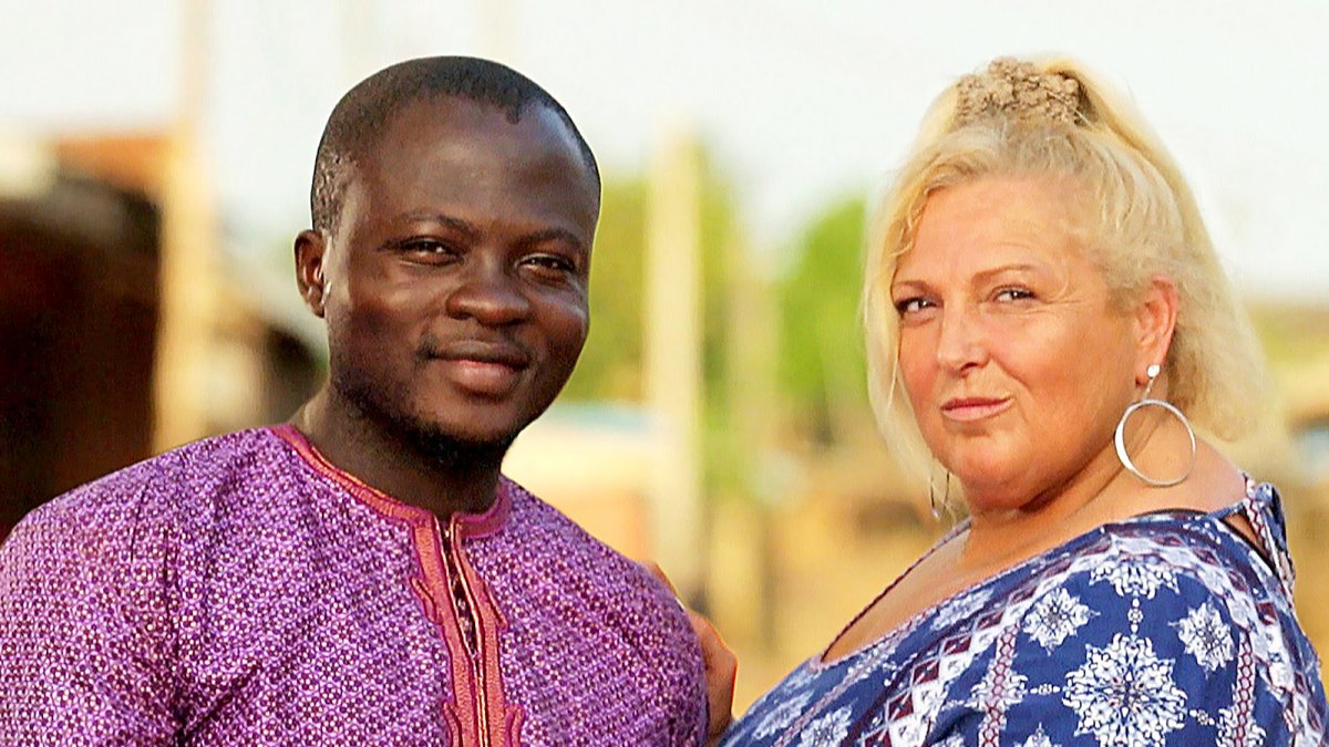 Michael Ilesanmi in a purple shirt and Angela Deem in a blue pattern shirt on '90 Day Fiancé' | TLC
