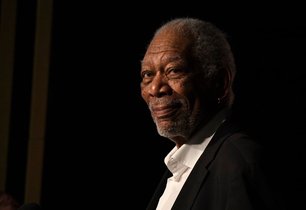 Morgan Freeman smirking while wearing a suit.