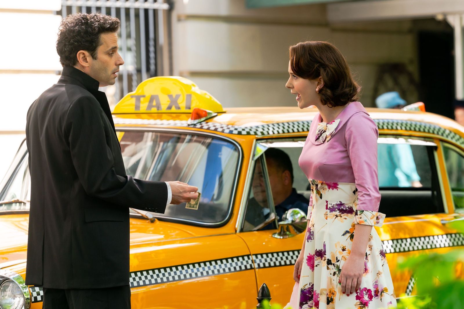 Luke Kirby and Rachel Brosnahan who play Lenny Bruce and Midge Maisel argue in the street on 'The Marvelous Mrs. Maisel'