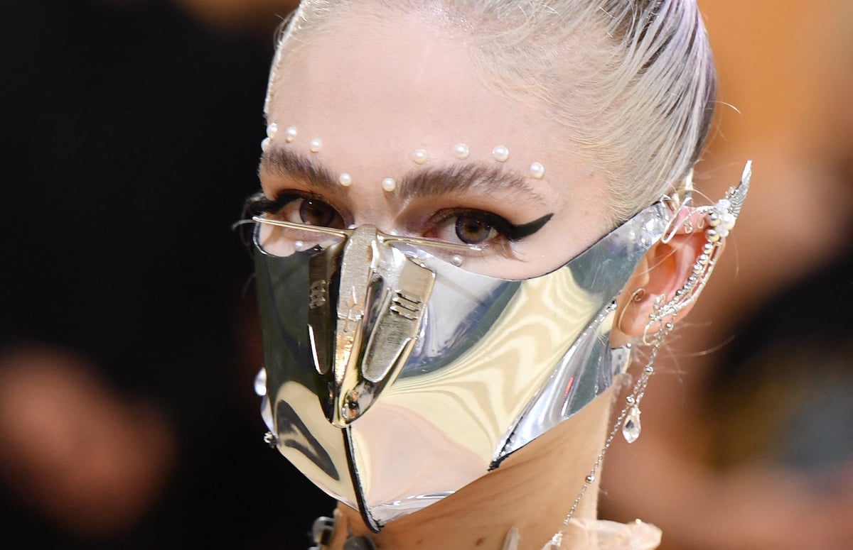 Music artist Grimes arrives at the 2021 Met Gala wearing a silver metal face mask