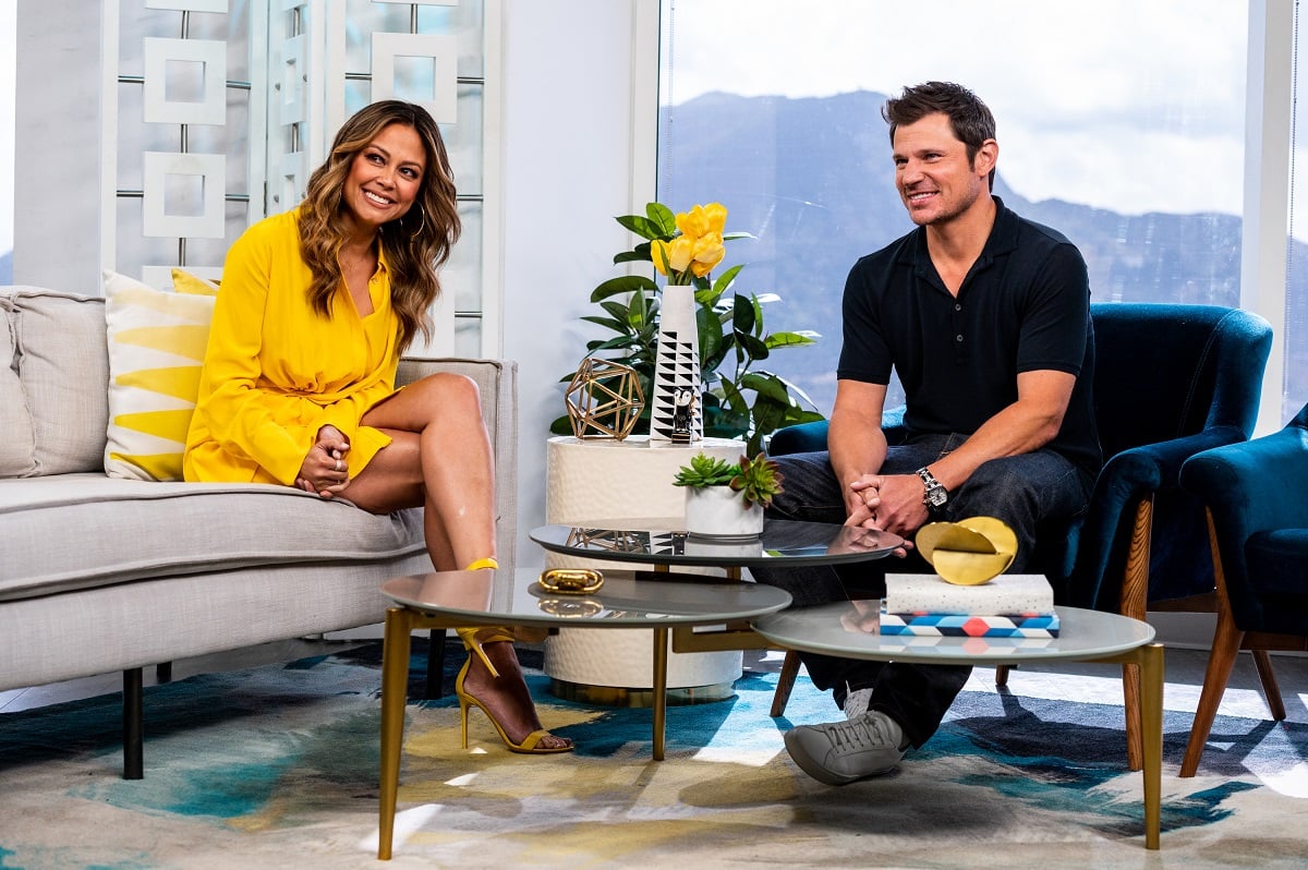 Nick and Vanessa Lachey smiling on the set of 'Daily Pop'