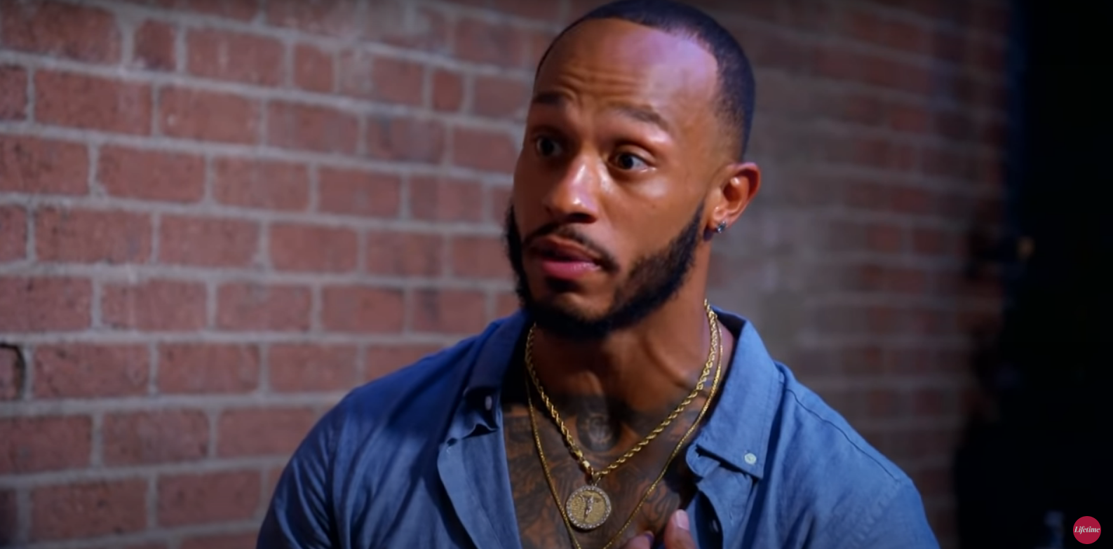 Olajuwon, wearing a blue button down shirt, in an episode of 'Married at First Sight'