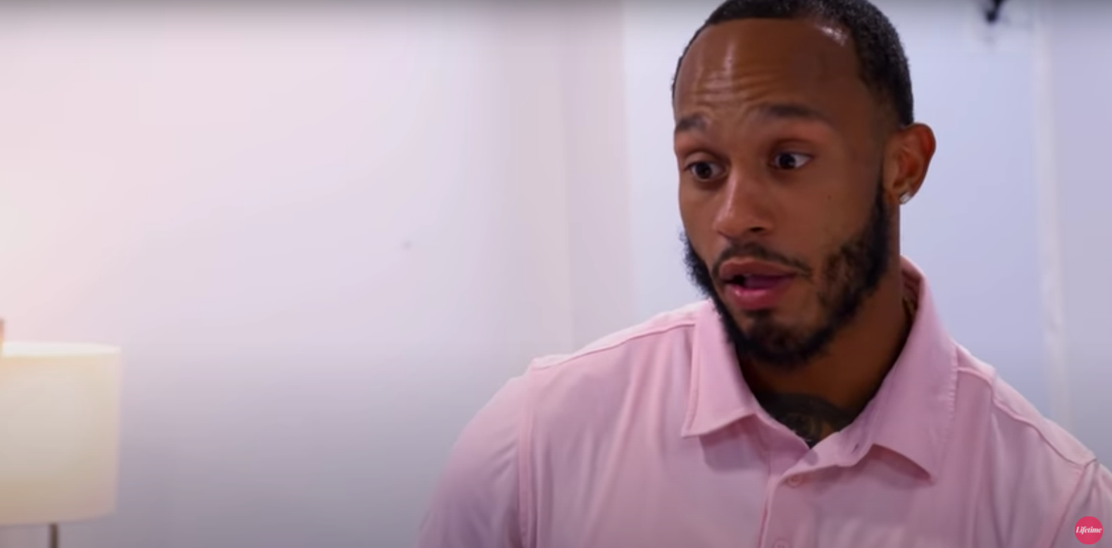 Olajuwon wearing a pink polo in episode of 'Married at First Sight'